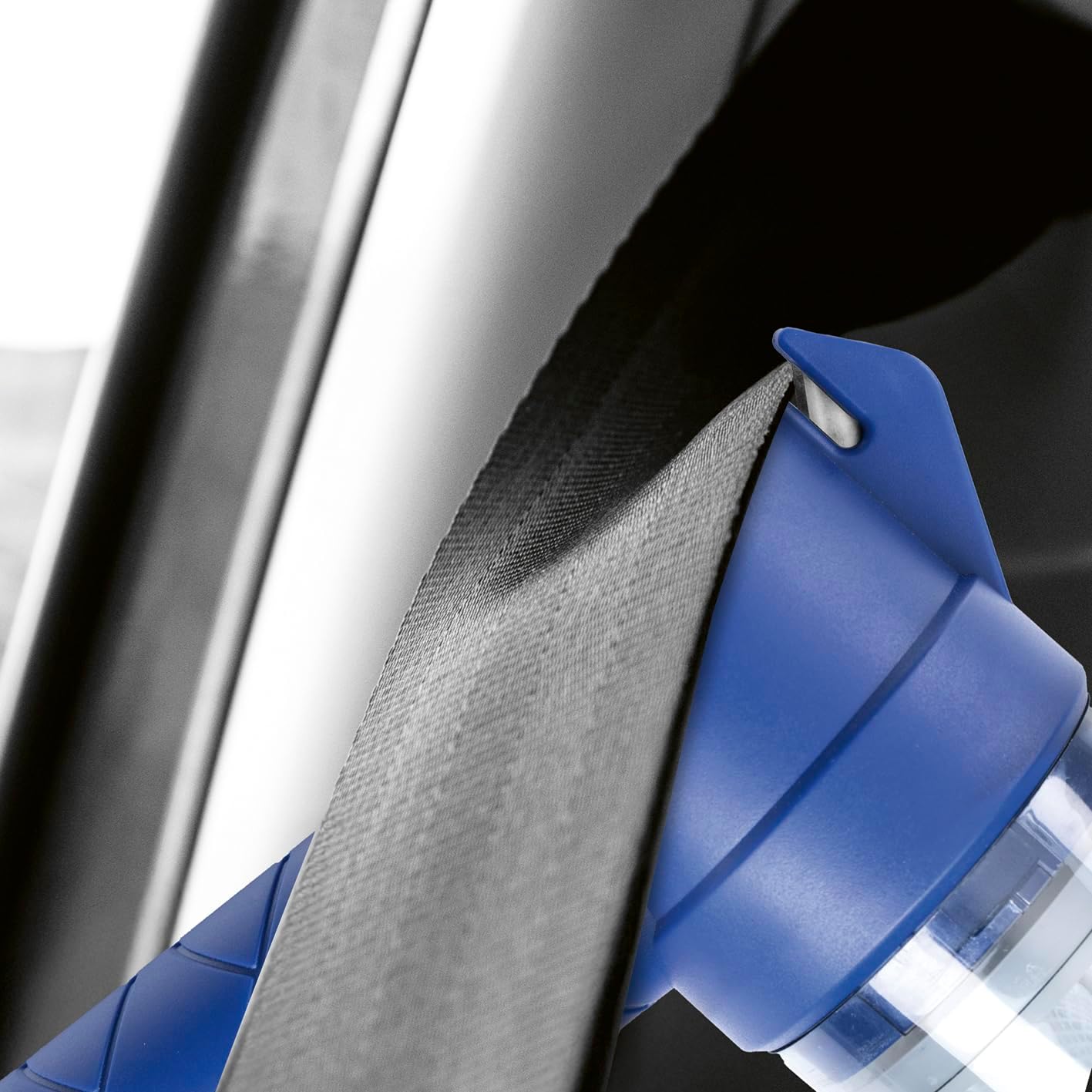 CLEANmaxx handheld vacuum's seatbelt cutter being used on a seatbelt