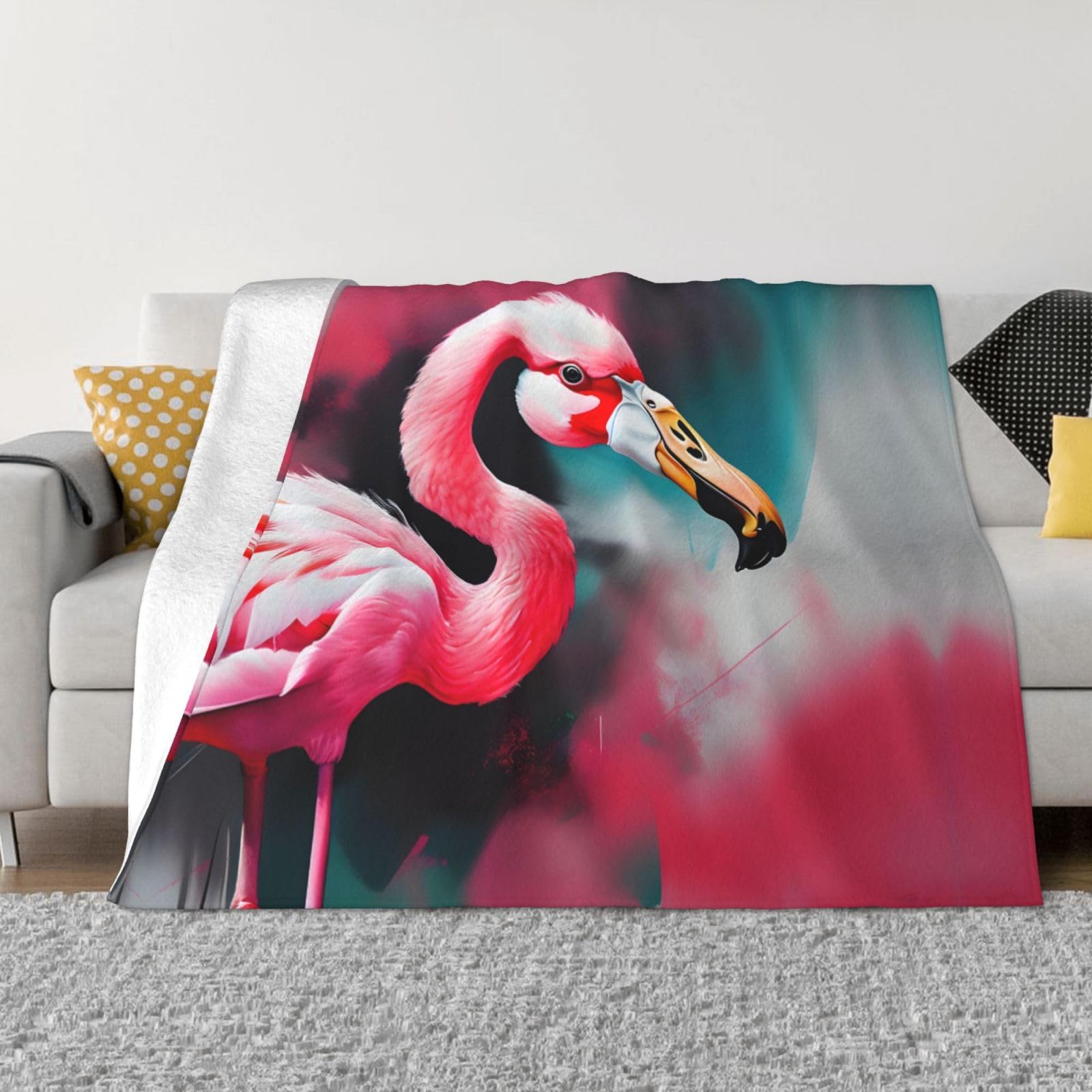 Plaid polaire flanelle flamant rose contre les frissons du soir sur le lit et canapé
