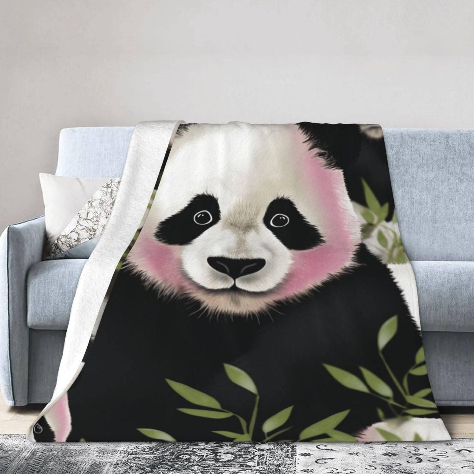 Plaid polaire léger panda contre le froid sur le canapé