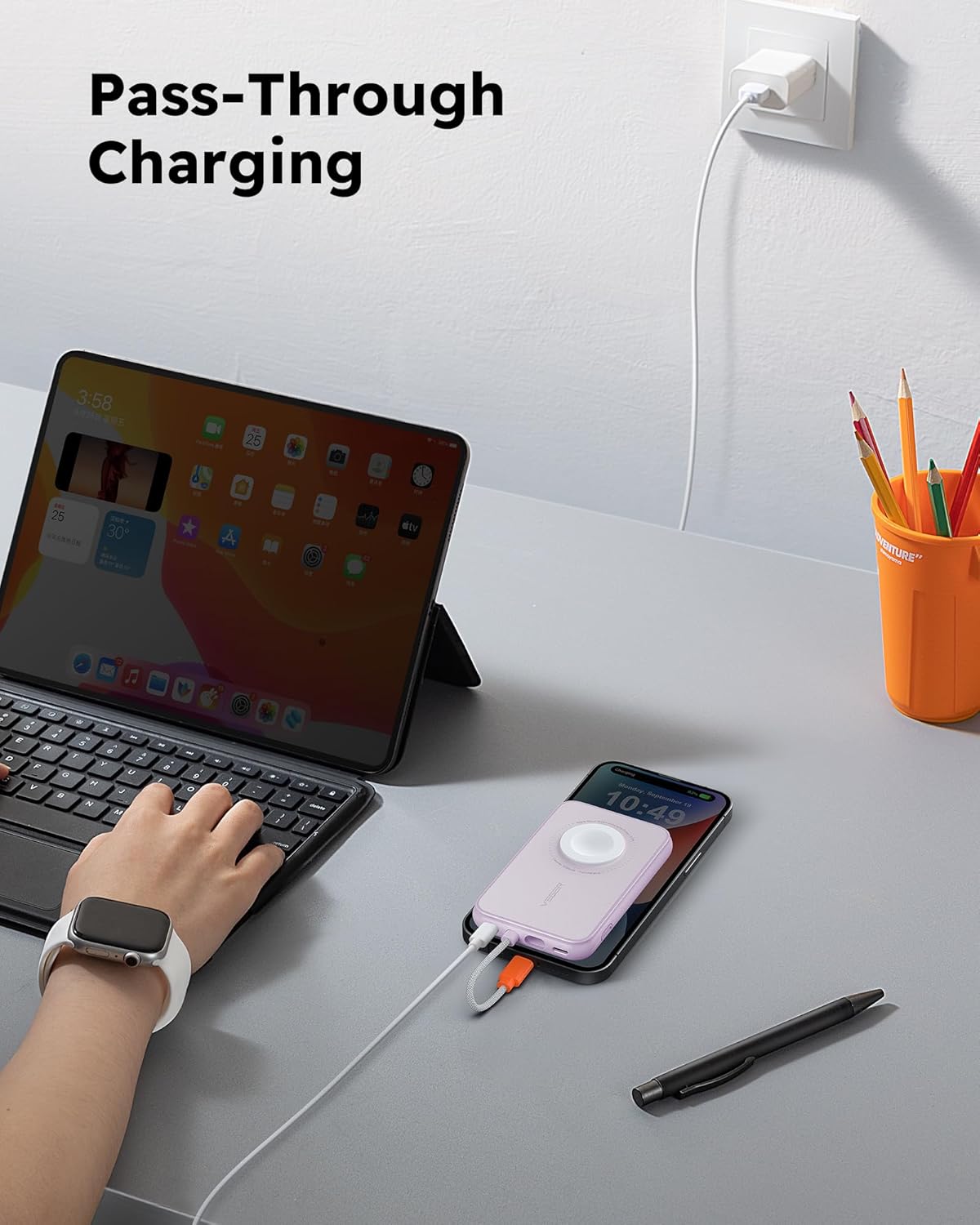 VEGER Portable Charger performing pass-through charging with an iPad and iPhone