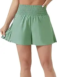 Short feminino de treino de cintura alta plissado lateral atlético com forro de malha bolso com zíper