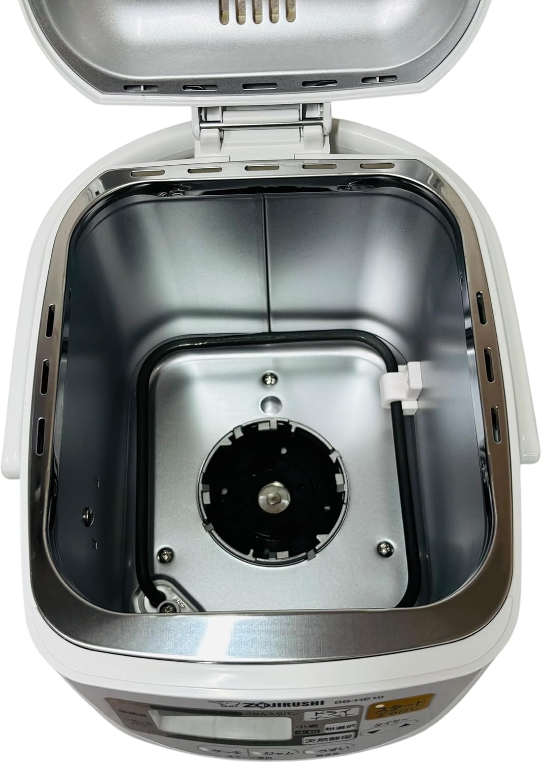 Interior of the Zojirushi bread maker showing the heating element and drive shaft