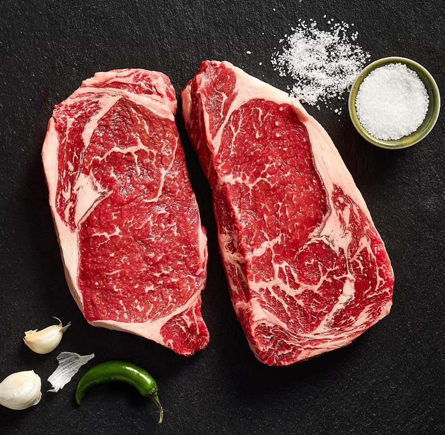 Beef Ribeye Steak , flavorful choice for any BBQ or cookout. These Canadian AAA graded steaks are equivalent to USDA Choice and are sure to impress your guests with their tenderness and taste. [ 32 oz , 2 pound ]