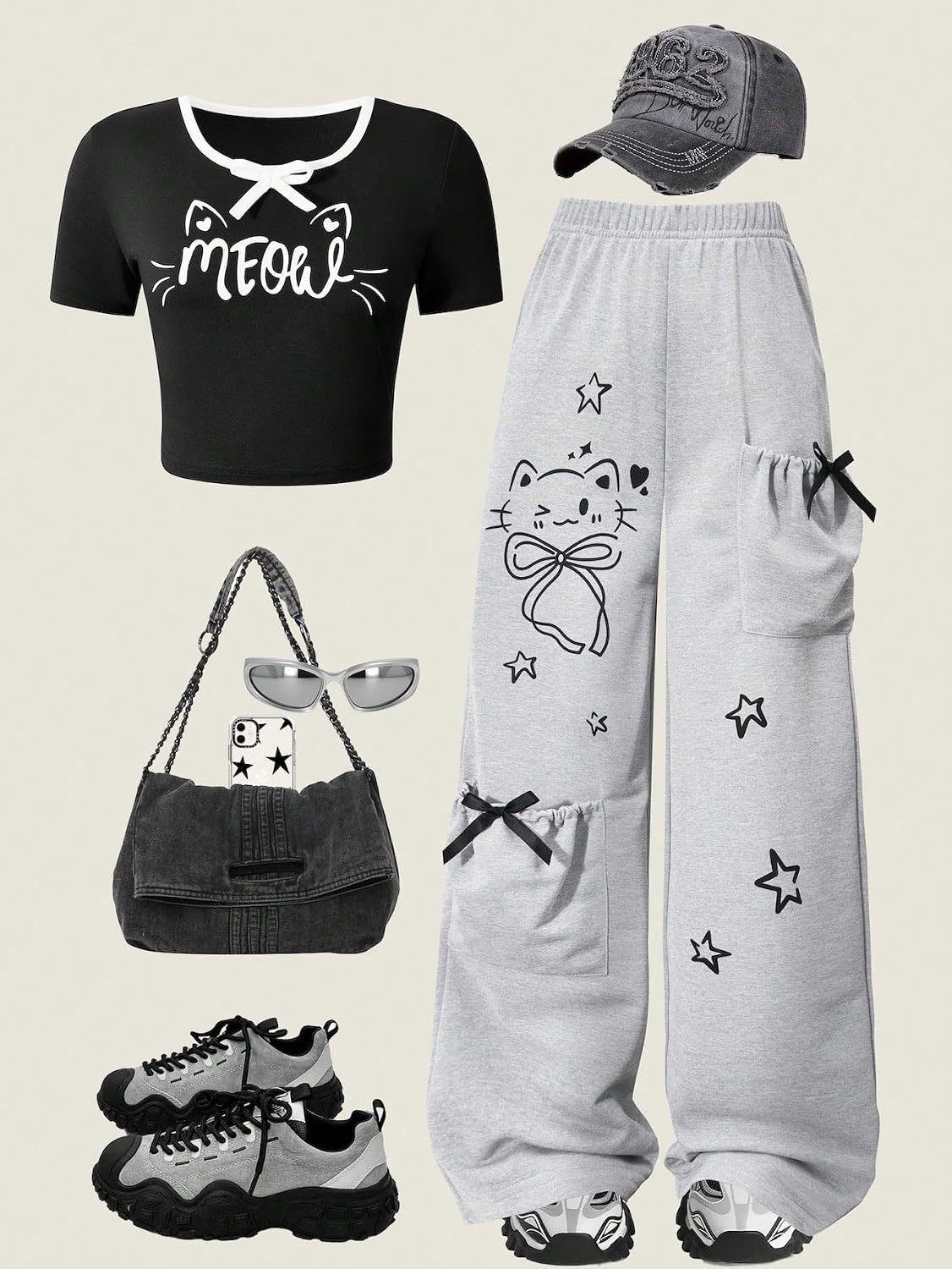 Girl's black short sleeved top with bow letters and cat print, paired with light gray straight leg pants