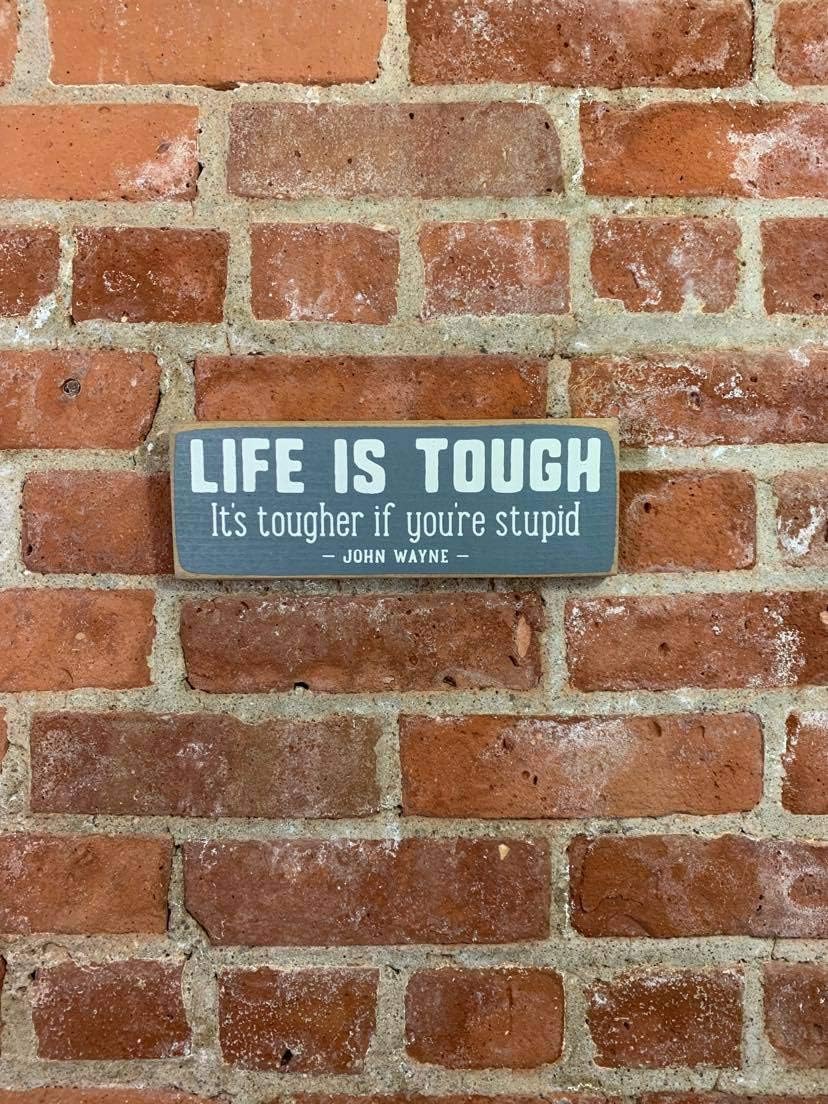 "Life Is Tough" Sawdust City Rustic Wooden Sign - Made From Solid Knotty Pine & Distressed Wood - White Stenciled Lettering Wall Art Room Decor On Slate Grey Background 10x3.5 : Home & Kitchen