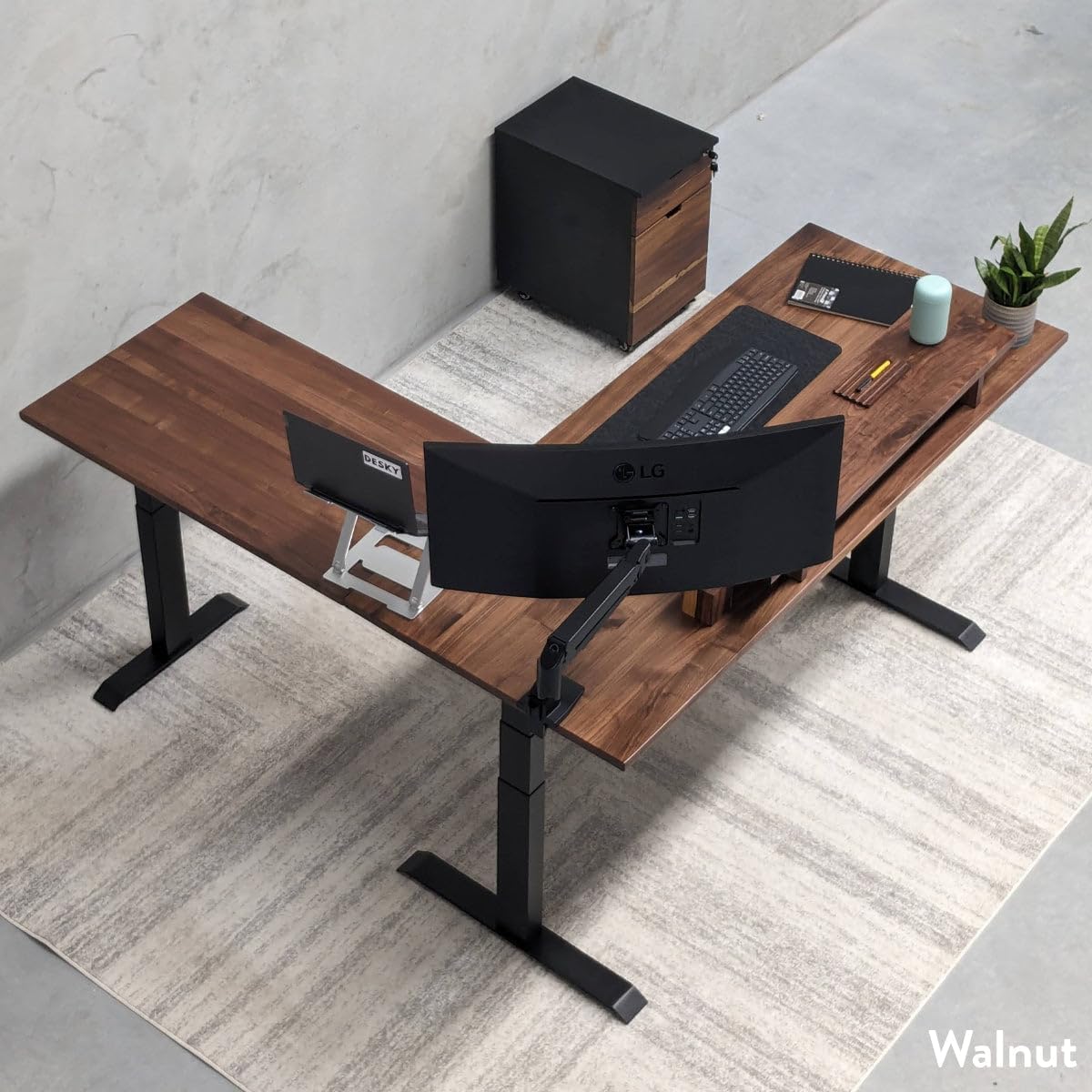 Desky L-Shaped Electric Standing Desk with dual monitors and accessories