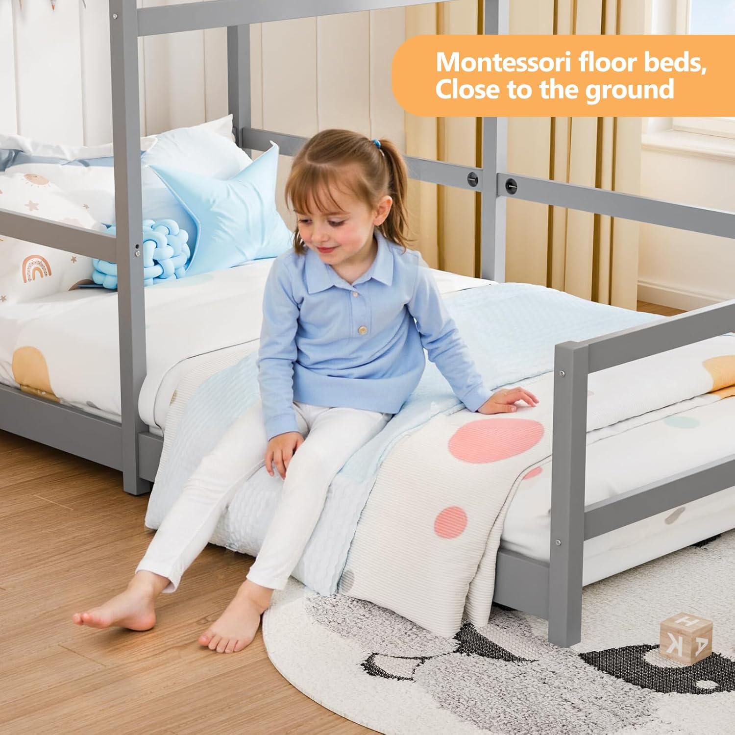 Image showing a child sitting on the low-to-ground bed frame.