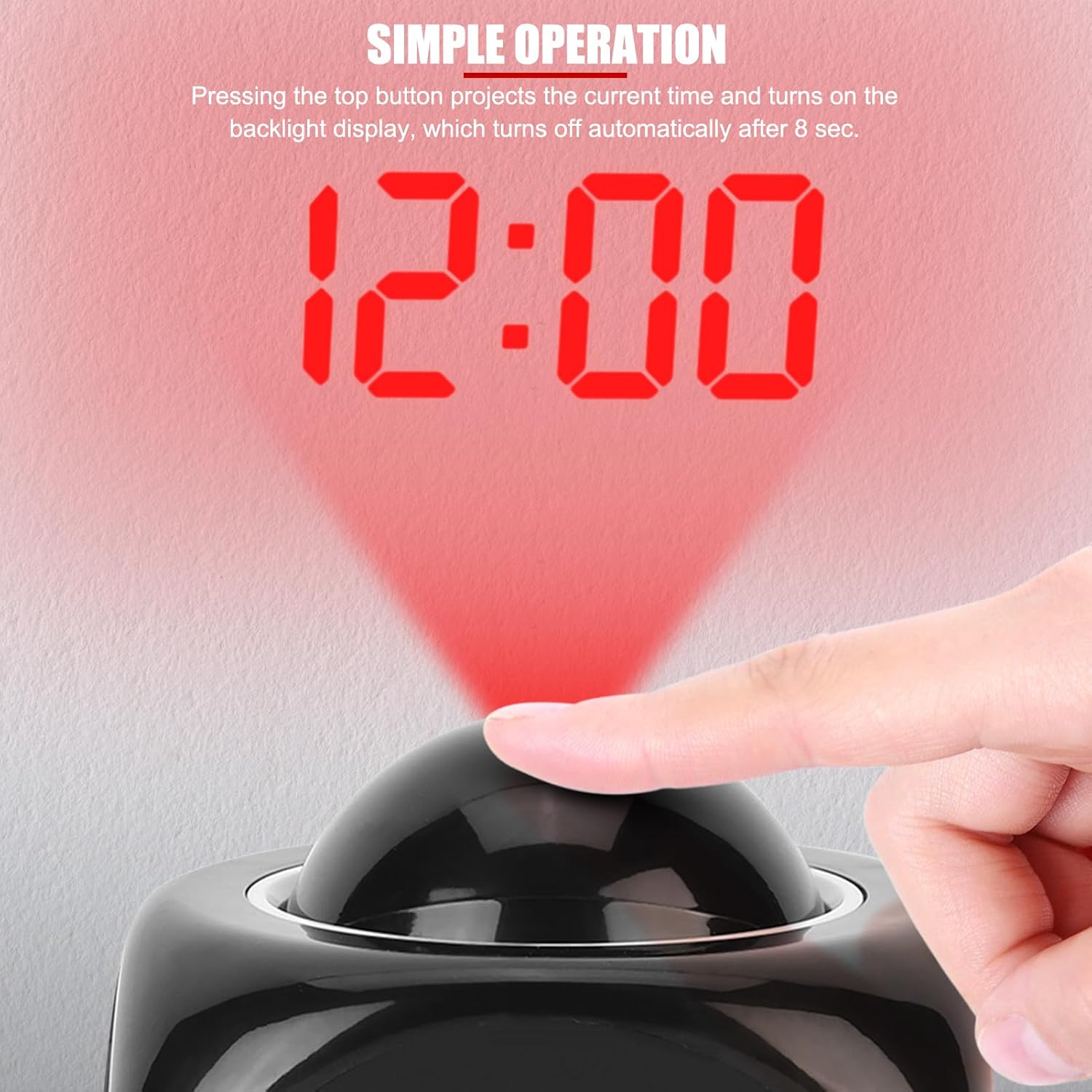 Hand pressing the top button of the EVTSCAN alarm clock to activate time projection.