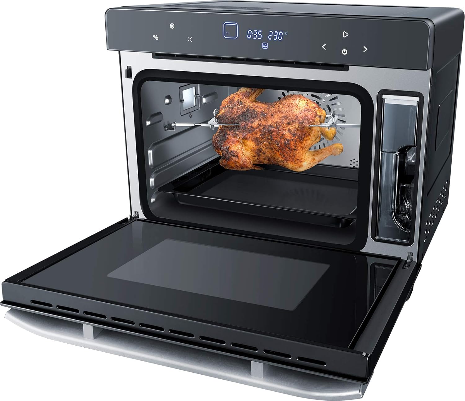 Steba DG 40 oven interior with a whole roasted chicken on the rotisserie spit.