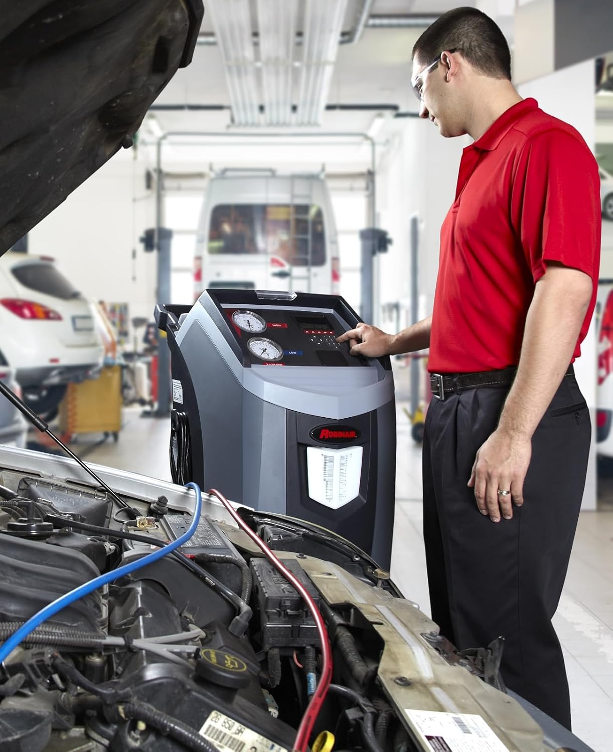 Technician operating Robinair 34788NI-H