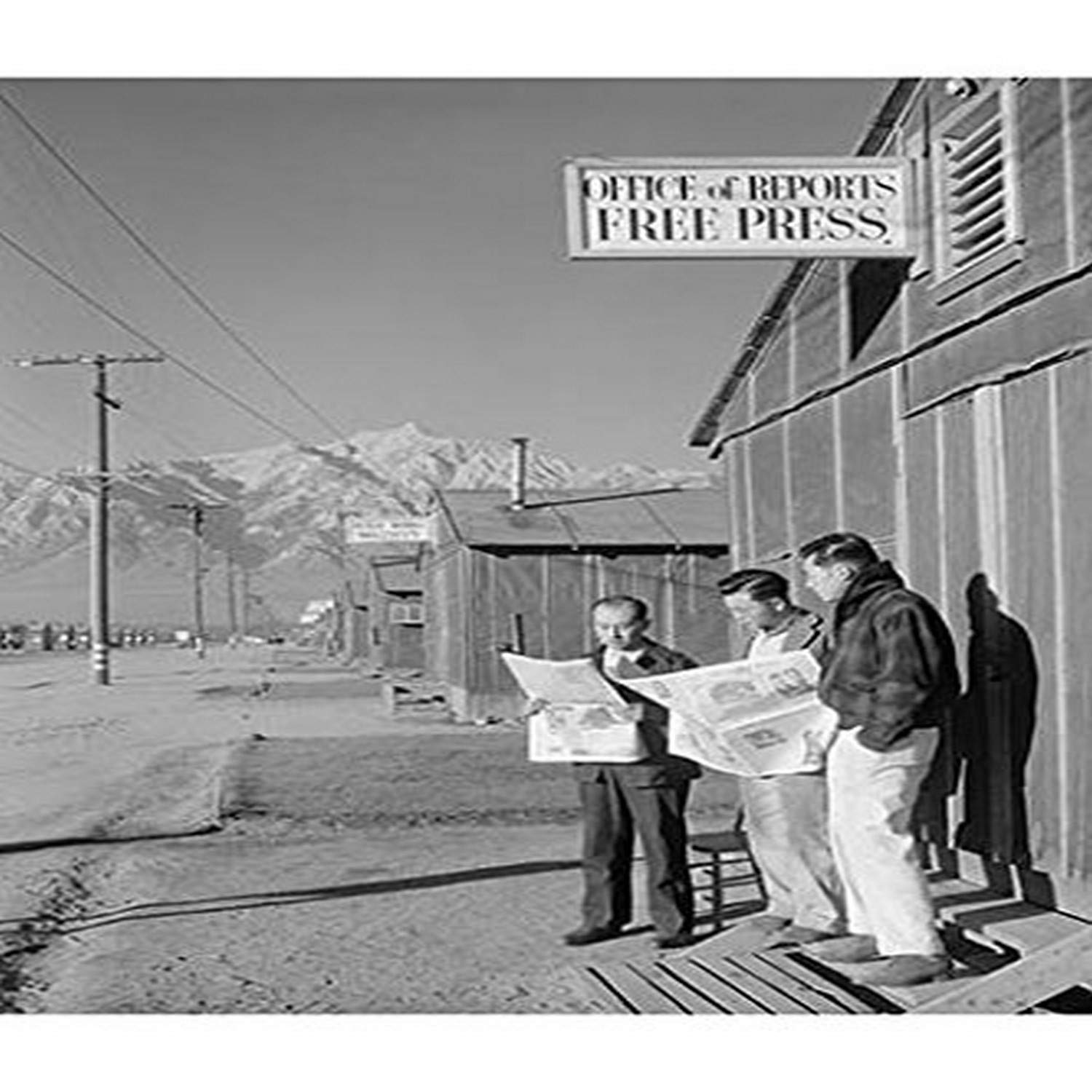 Buyenlarge Roy Takeno (Editor) and Group Reading Manzanar Paper [I.E. Los Angeles times] in Front of Office, Yuichi Hirata, Nabuo Samamura - Gallery Wrapped 24"X36" canvas Print., 24" X 36""