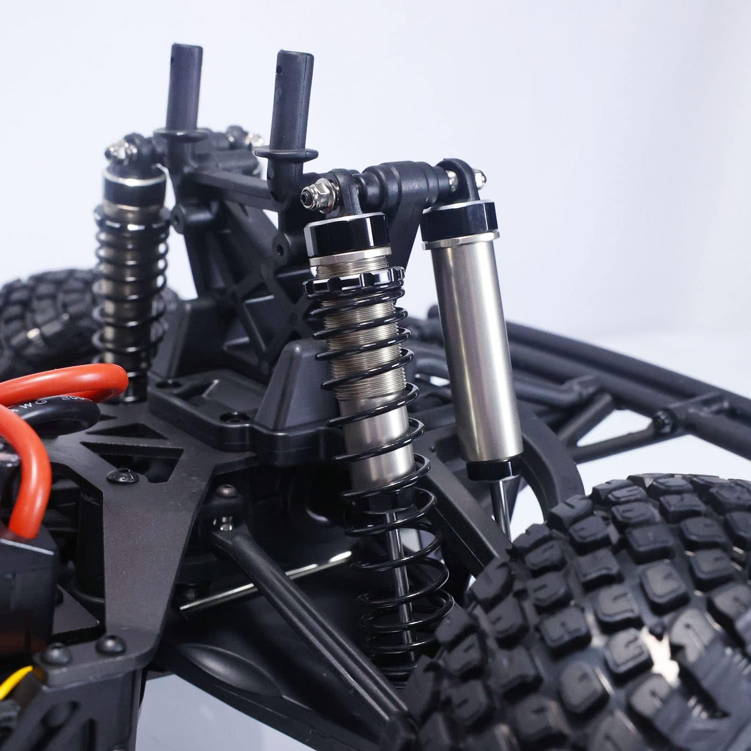 Close-up of the suspension system on the TOUCAN RC HOBBY Yikong DF7 V2 RC Car