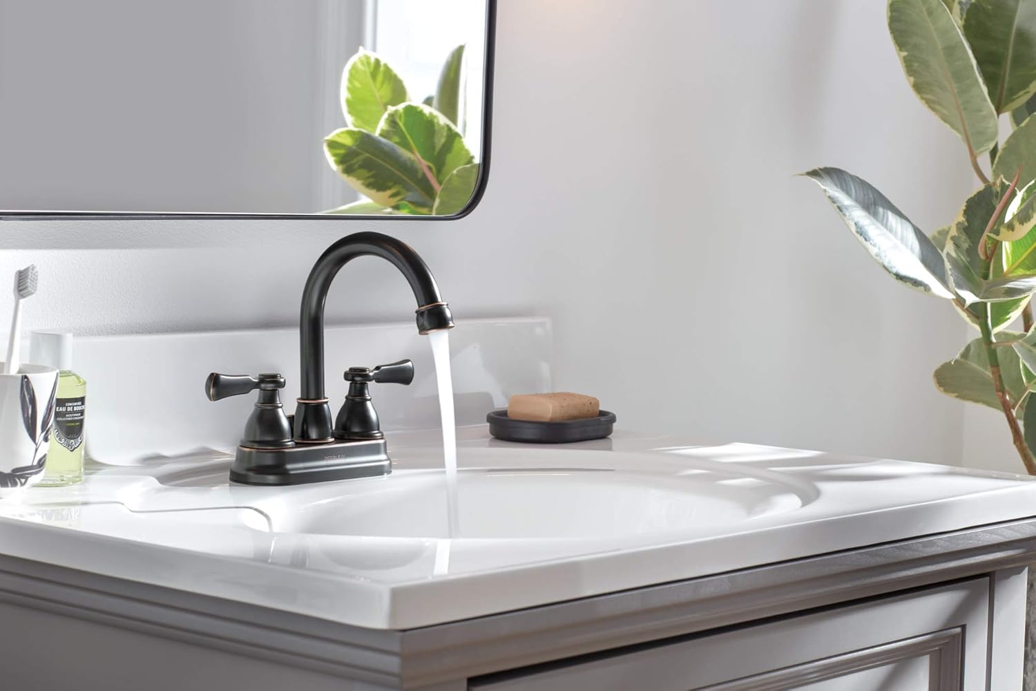 Peerless Elmhurst Faucet with water flowing.