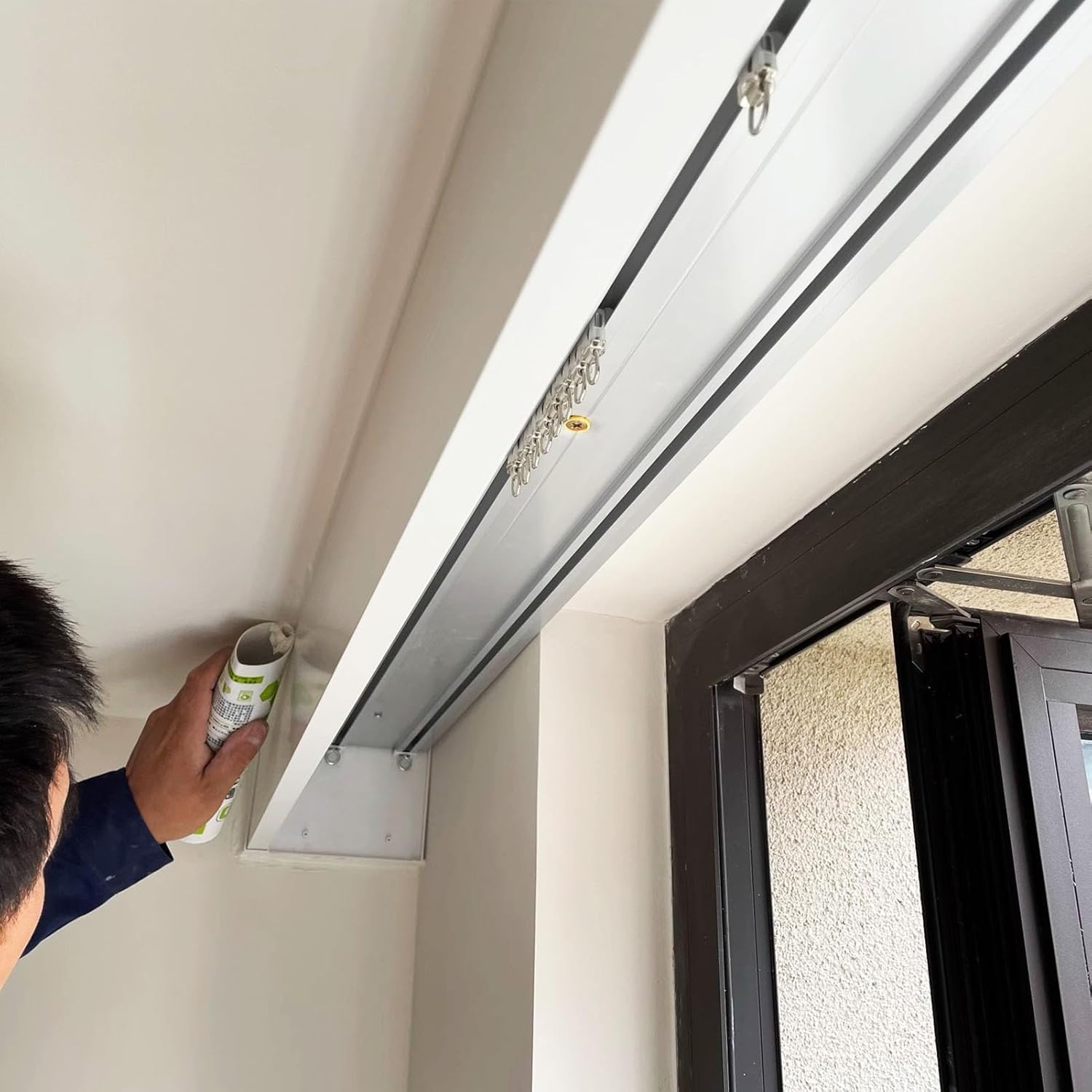 Three-in-one Double Rail Curtain System: Opaque Aluminum Rail, wall/Ceiling Mount, Window Cassette Box and Metal Hooks for Added Privacy and Style.