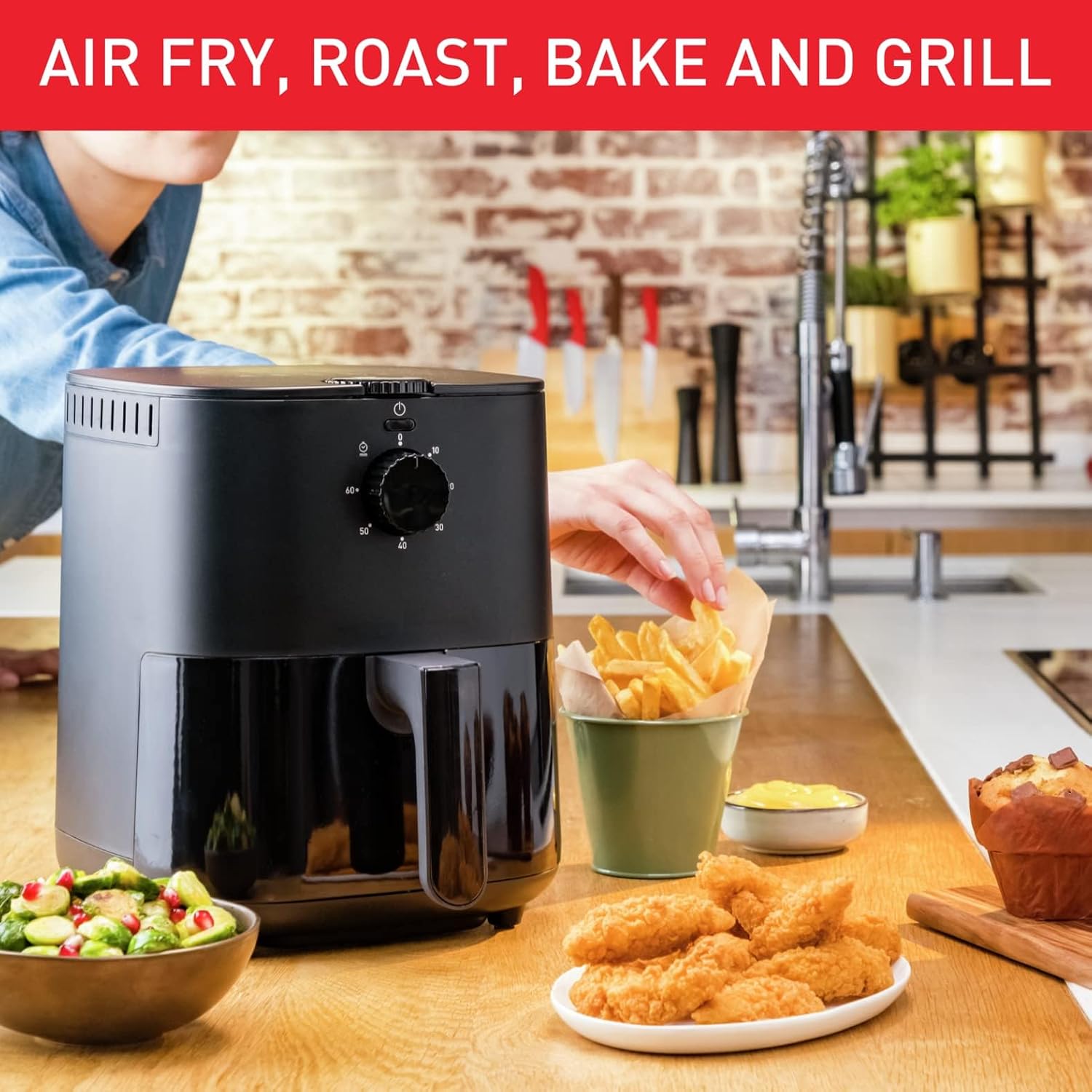 Tefal Easy Fry Essential EY1308 Air Fryer with basket pulled out, containing fries