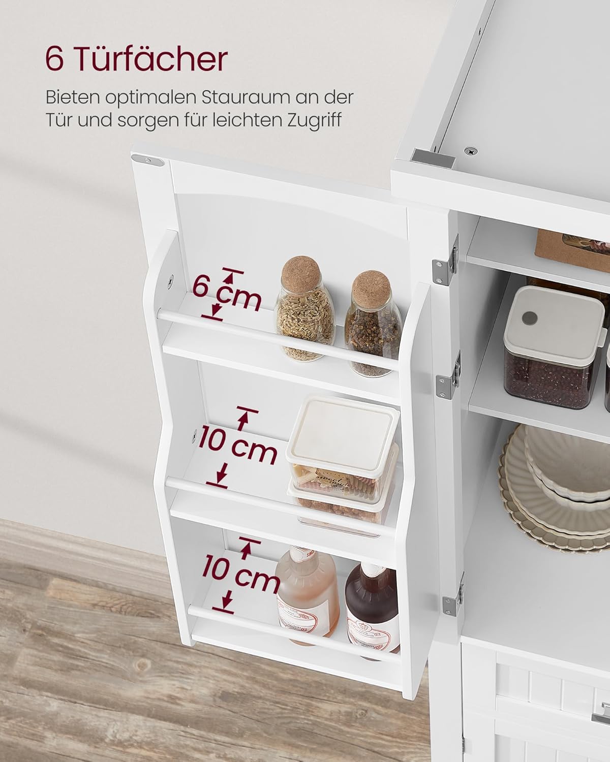 Open drawer filled with cutlery and dishes.