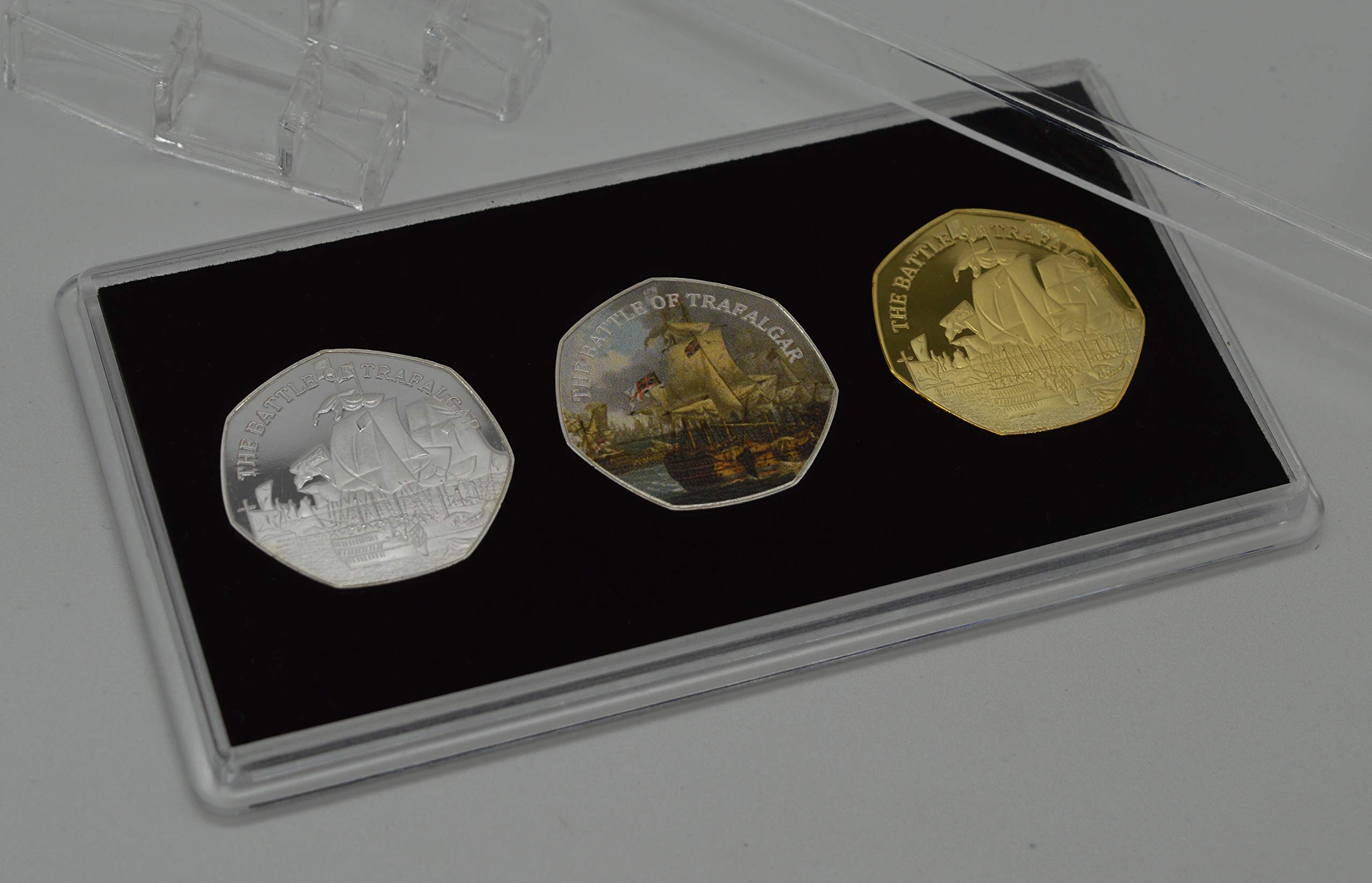 Trio of VICE-ADMIRAL HORATIO NELSON, BATTLE OF TRAFALGAR Commemoratives in 50p Coin Display Case. Silver, 24ct Gold, Full Colour