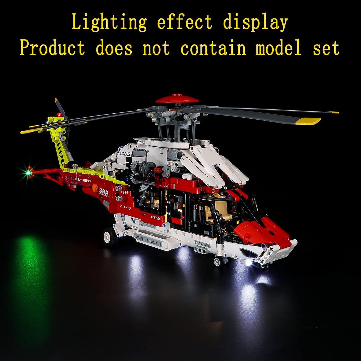 The Lego Airbus H175 helicopter model illuminated by the LED light kit, viewed from the side in a dark setting.