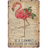 The Inspirational Quote: `Be a Flamingo in a Flock of Pigeons` on a White Background. Stock
