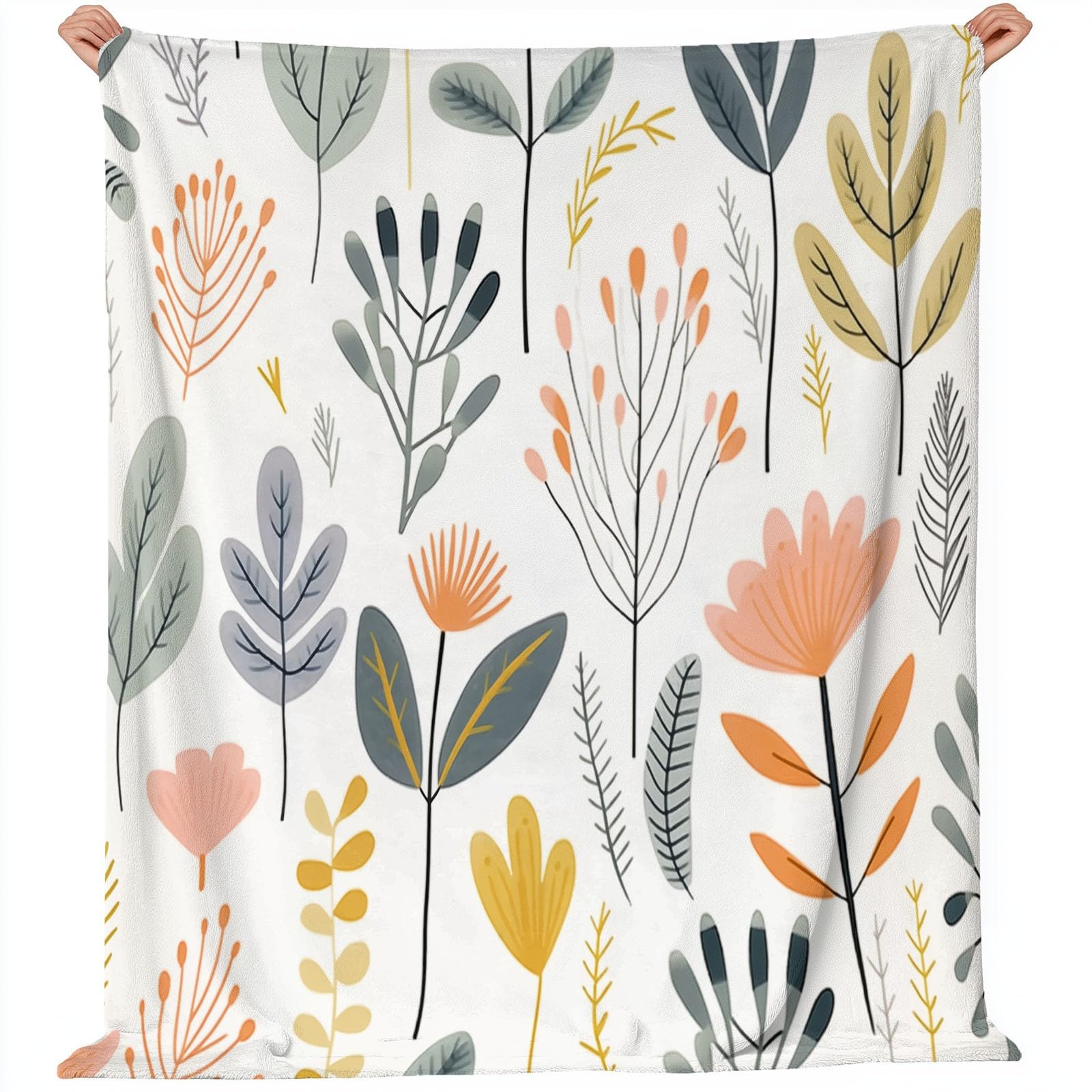 Couvre-lit d'hiver beige feuilles nordiques pour soirées cocooning sur canapé