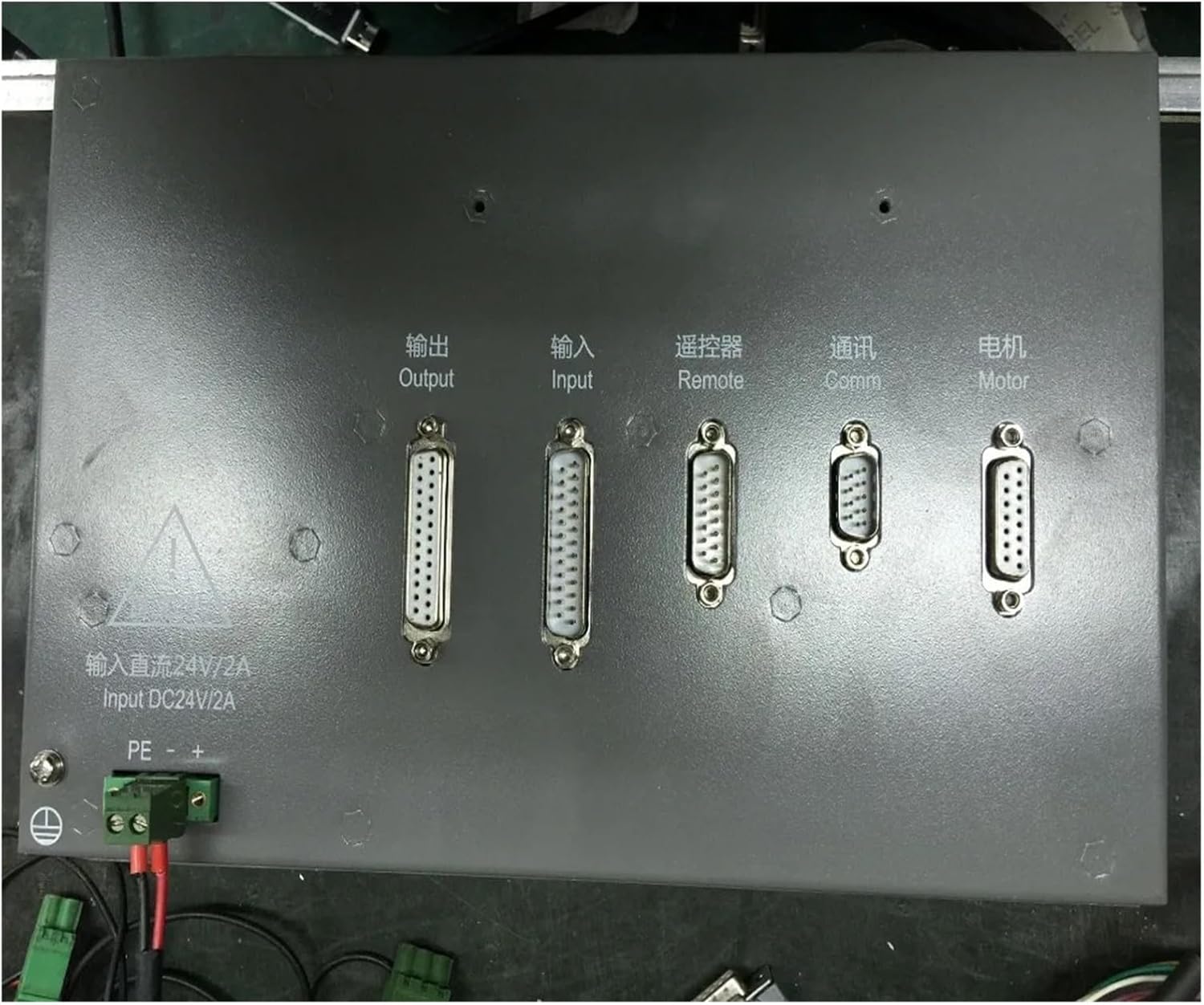 Rear view of the SF-2100C CNC Lathe Controller, showing various input and output ports for connection to external devices.