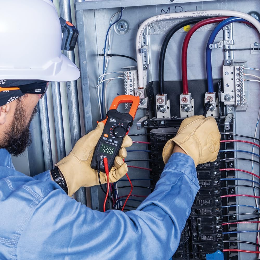 Electrician Uses Klein Clamp Meter to Test Electrical Panel