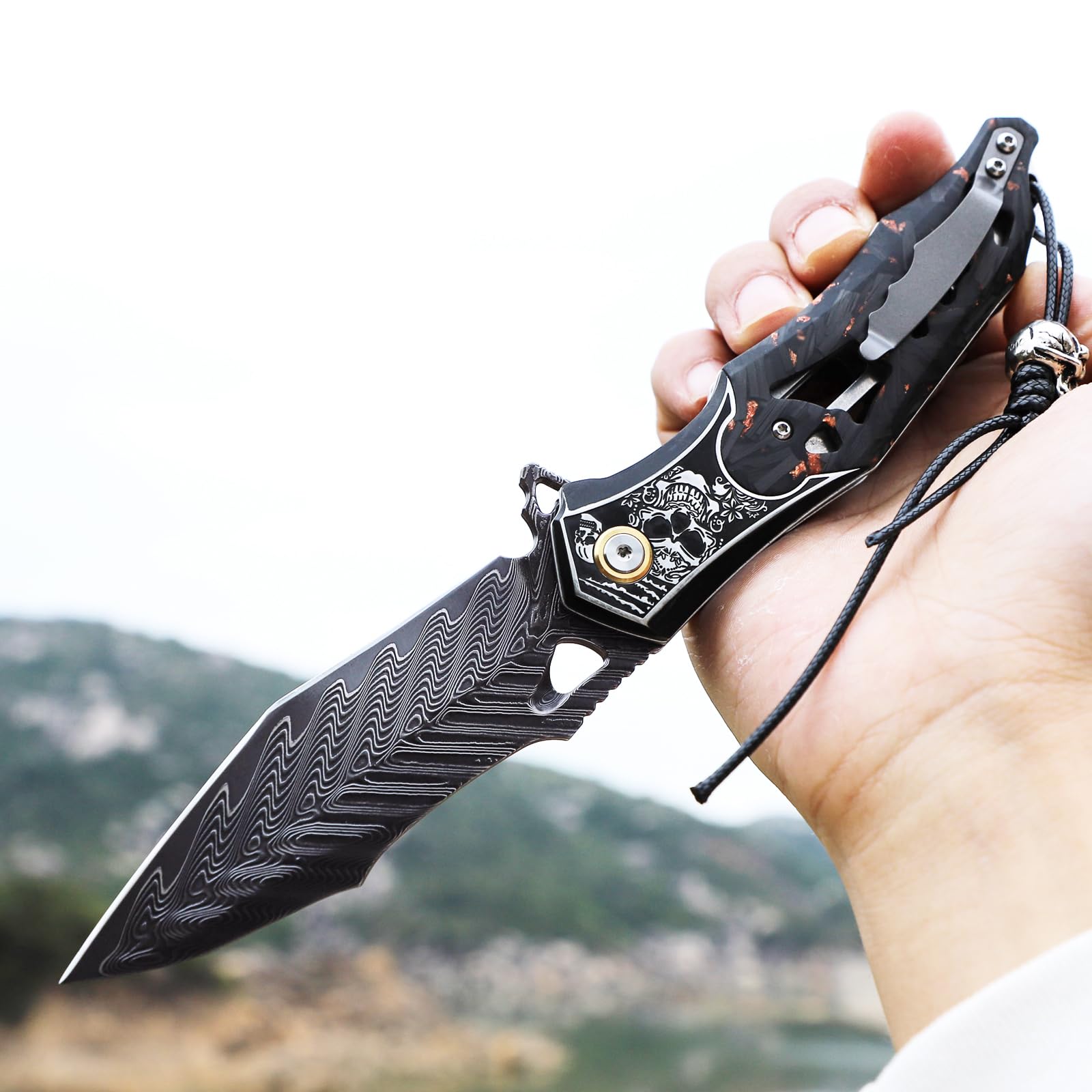 Handmade Men's Folding Pocket Knife, 9" Damascus Steel Folding Knife, Includes a leather sheath, Dazzling Cool Skull pattern, Carbon fiber handle with copper foil integration, Ideal for expedition cam