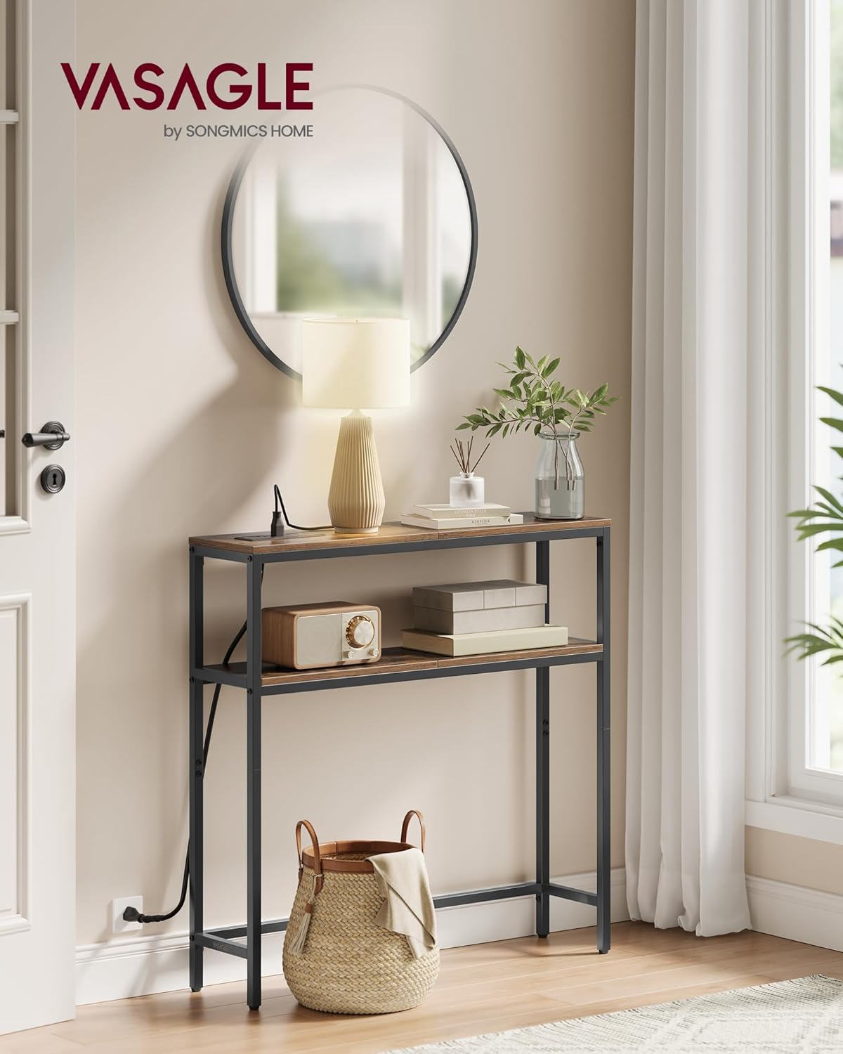 VASAGLE Console Table placed in an entryway next to a door, with a mirror above it and a lamp on top, demonstrating its use in a home setting.