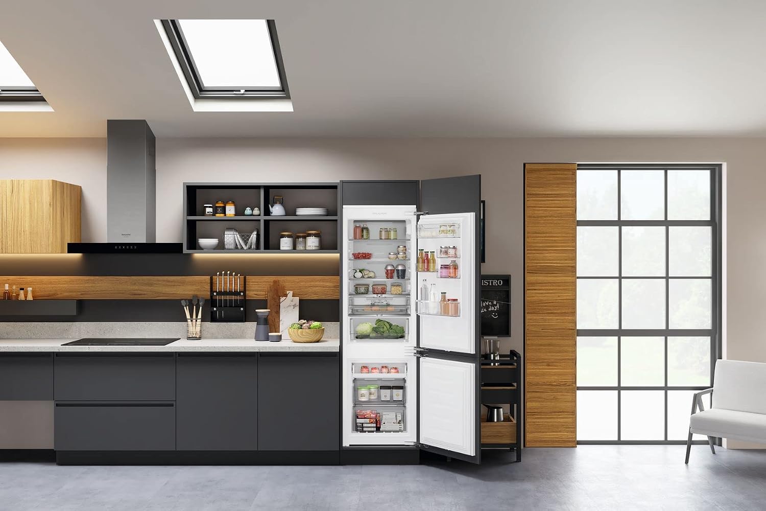 Bauknecht KGITN 18F2 M integrated refrigerator-freezer with doors open, showing interior shelves and drawers.