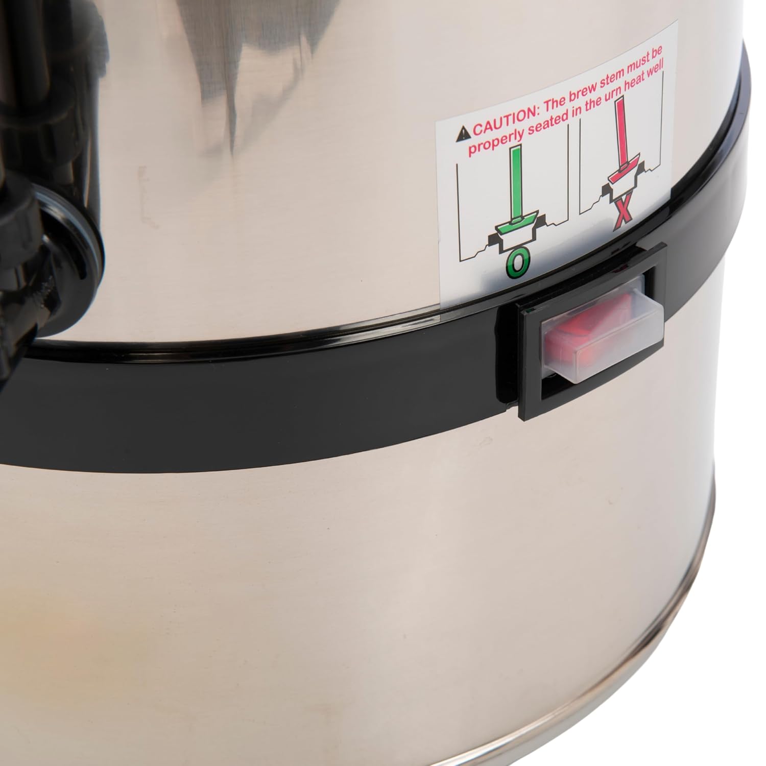 Close-up of the FSE CP-40 percolator's power switch and a warning label