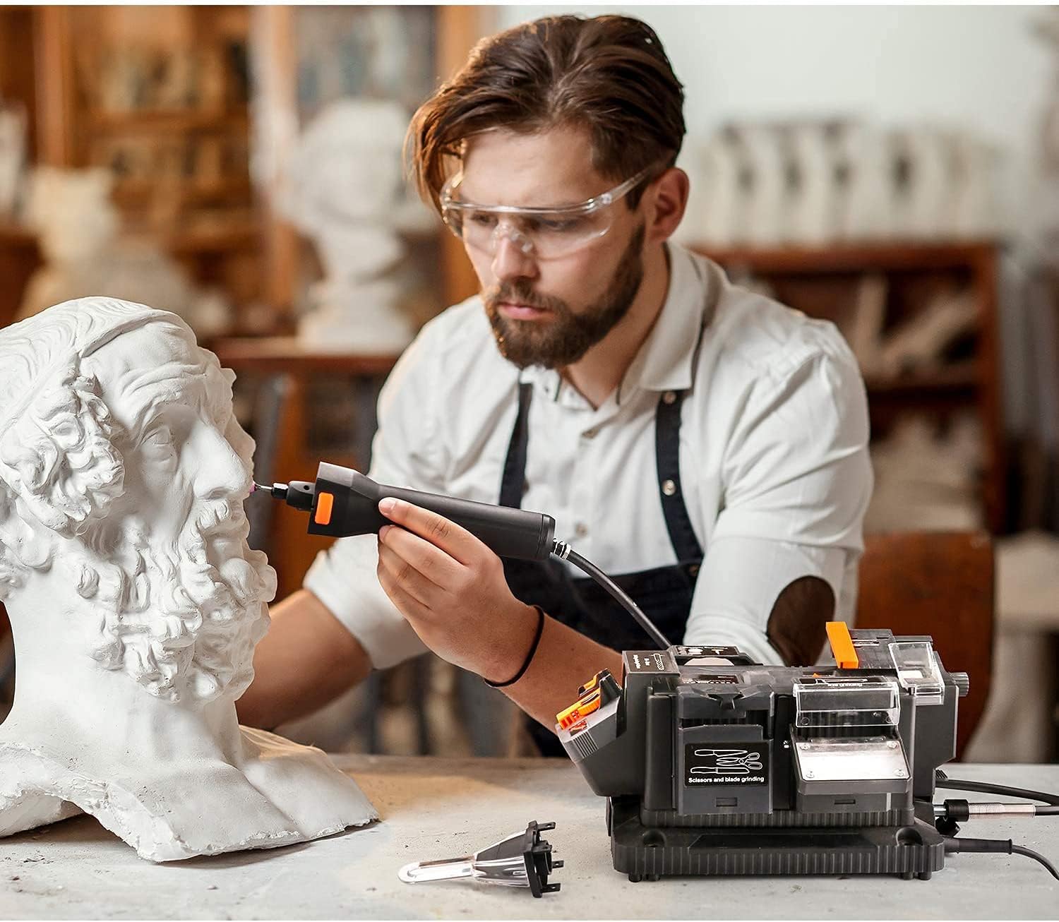 Man using the flexible shaft for detailed carving work