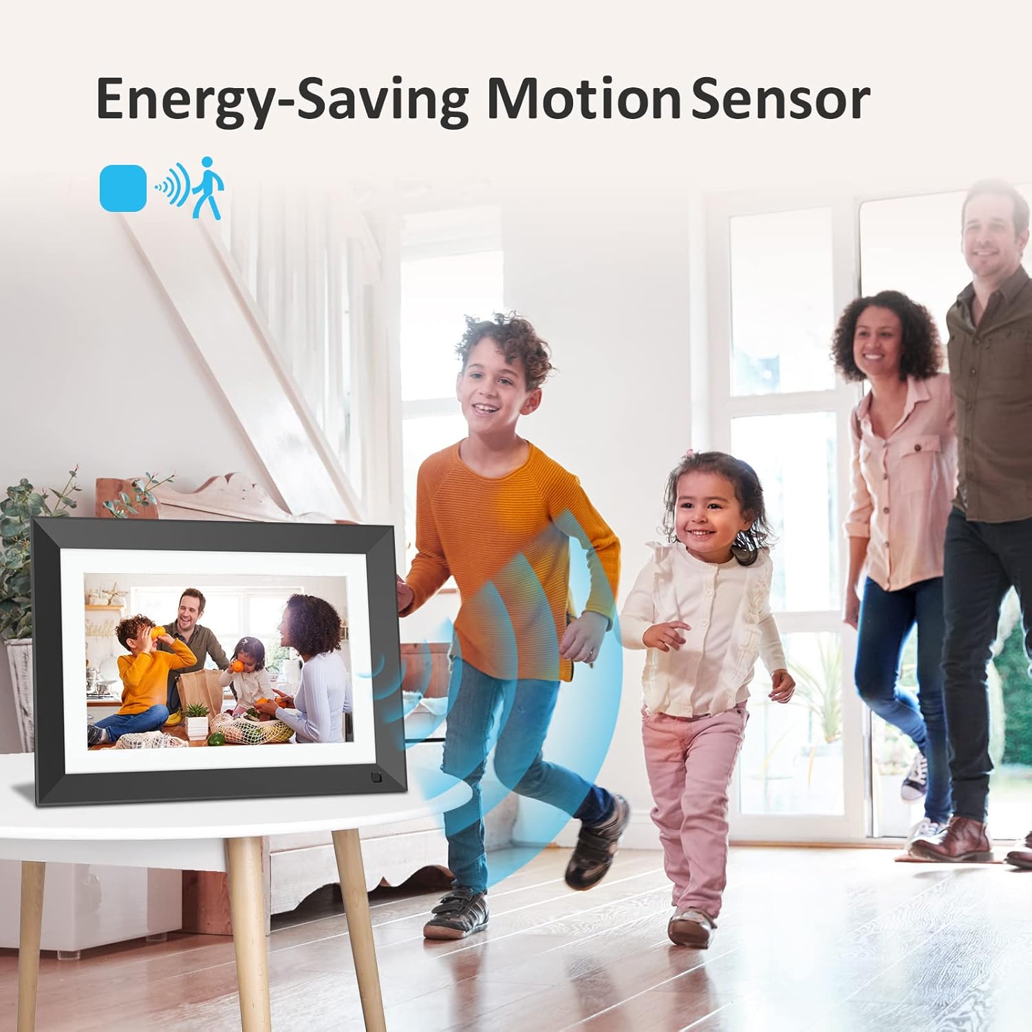 A family entering a room, with the digital photo frame on a table, showing a motion sensor icon and blue waves indicating detection.
