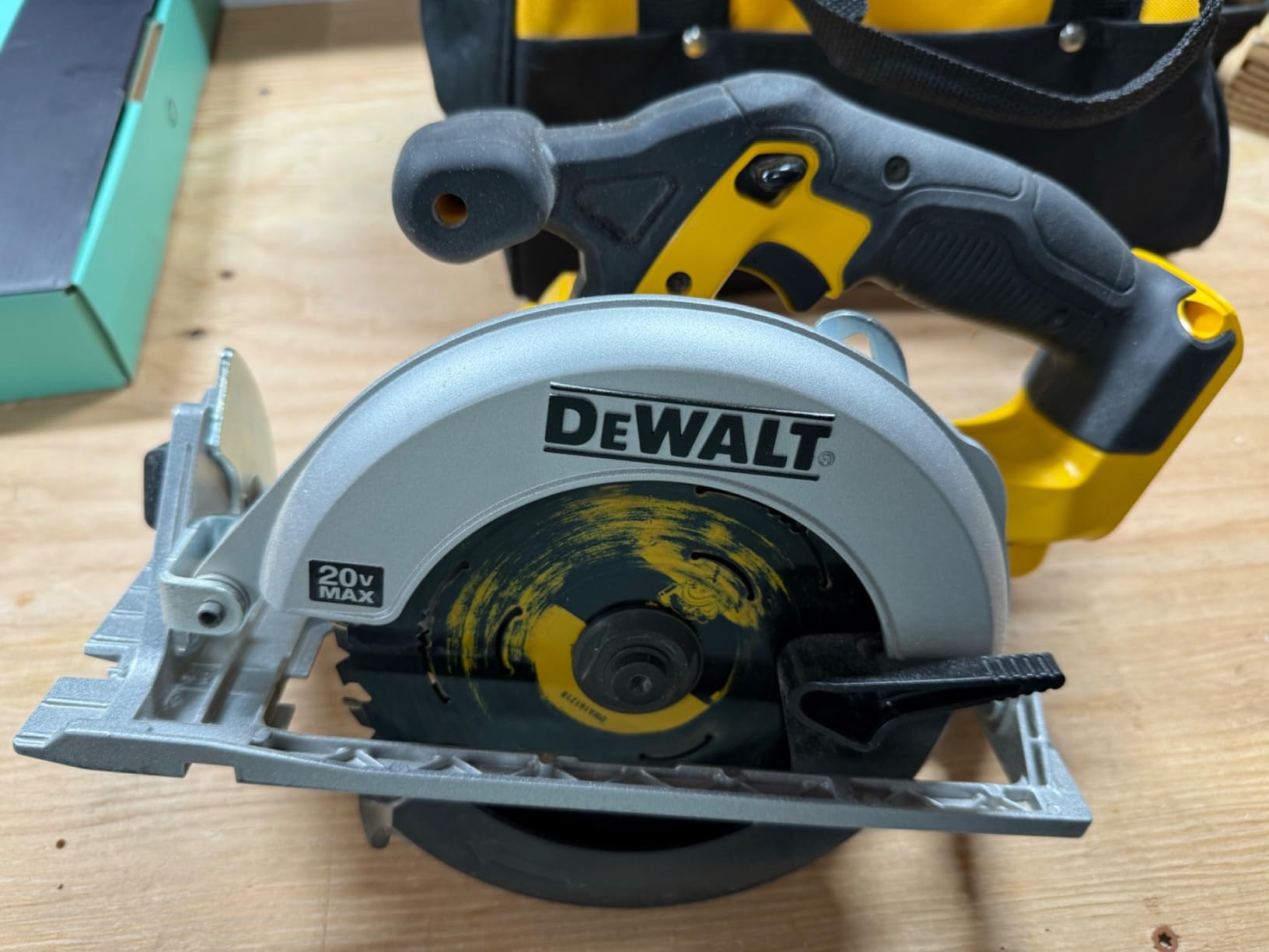 DeWalt circular saw cutting through a piece of lumber on a job site