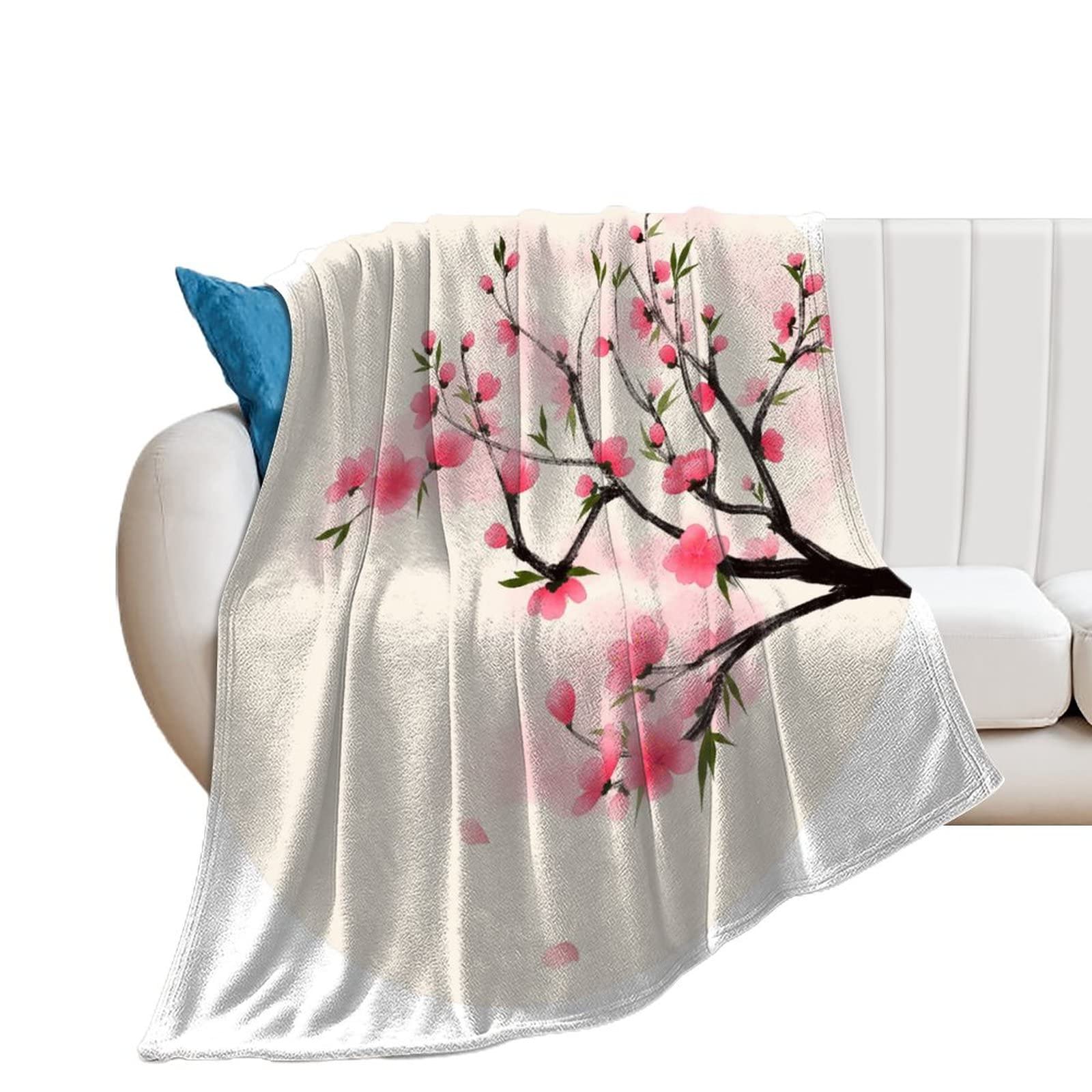 Couverture fleur de pêcher en flanelle pour vos soirées cocooning au salon