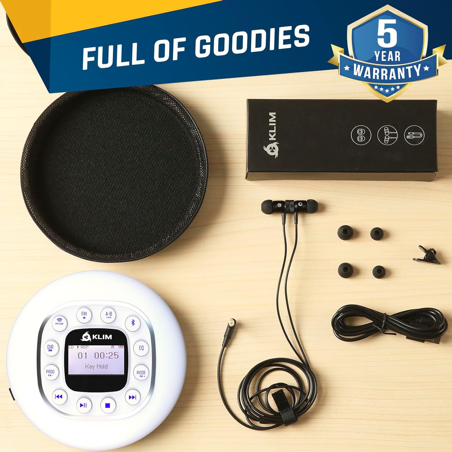 Contents of the KLIM Journey package laid out: CD player, earphones, charging cable, and carry pouch.