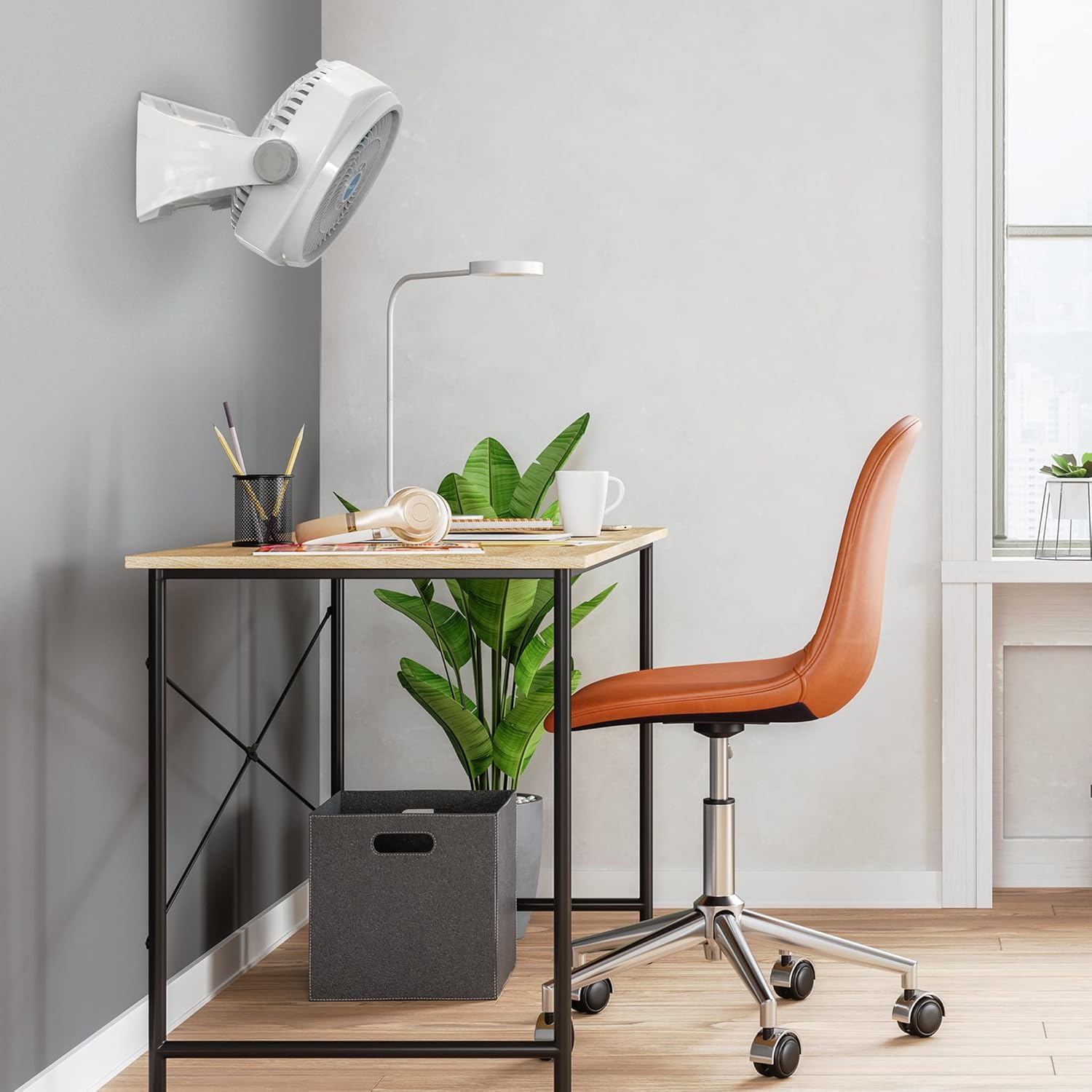 NewAir 12-inch Air Circulator Fan mounted on a wall above a desk