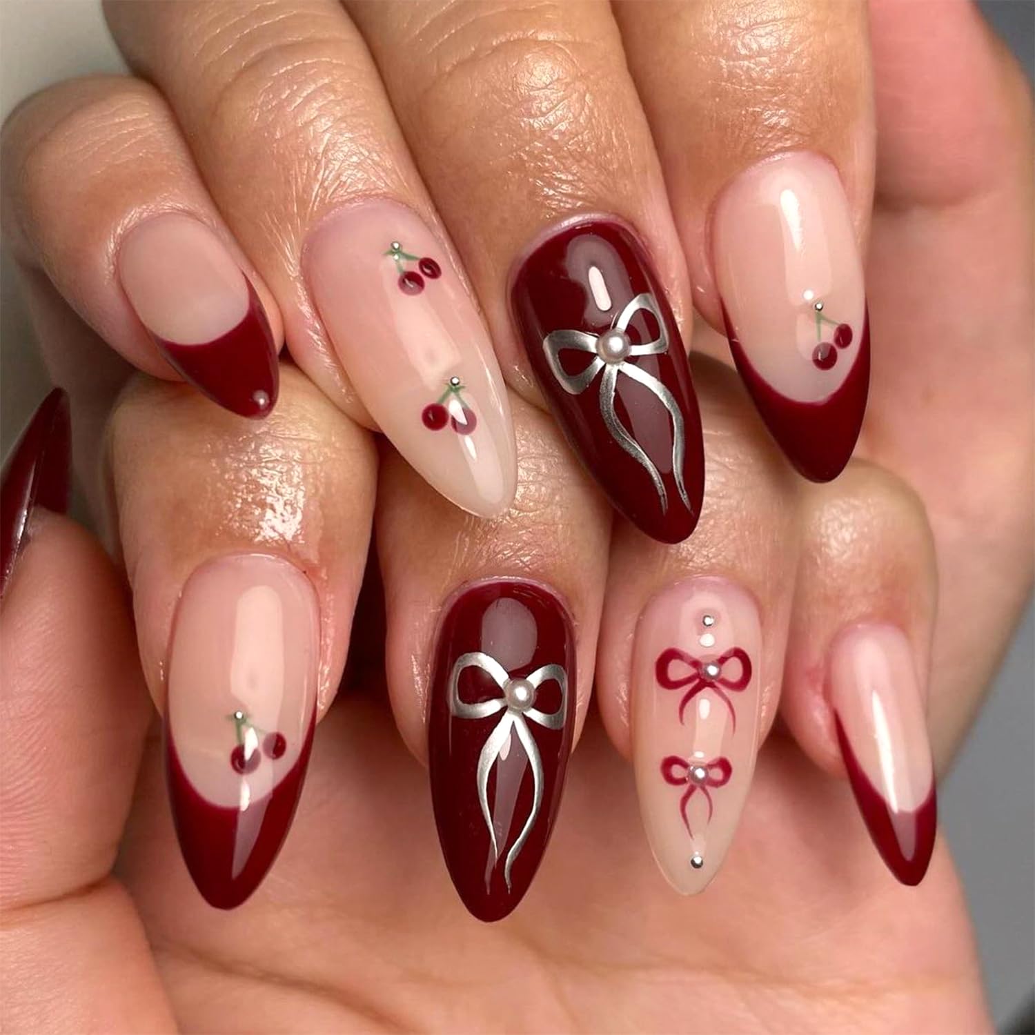 Vopintpy Silver Bow Press on Nails Long Almond Fake Nails Wine Red French Tip Acrylic Nails with Cherry Design Glossy Nude Glue on Nails Reusable