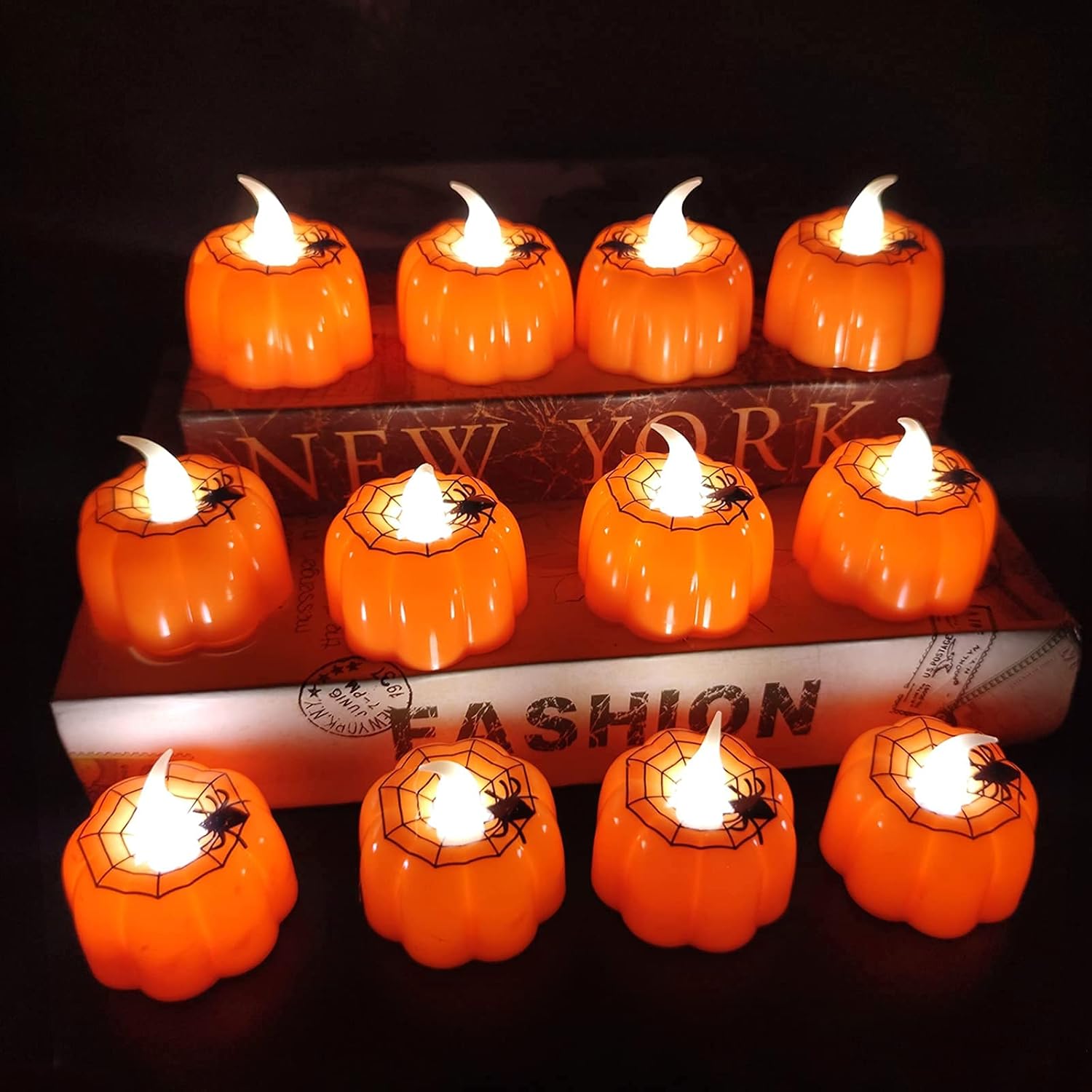 TURNMEON 12 Pack Halloween Pumpkin Tealights Candles with Spider Web Decor, LED Pumpkin Lights, Flame Less Candle Battery Operated Halloween Table Decorations Home Fireplace Party Thanksgiving Fall
