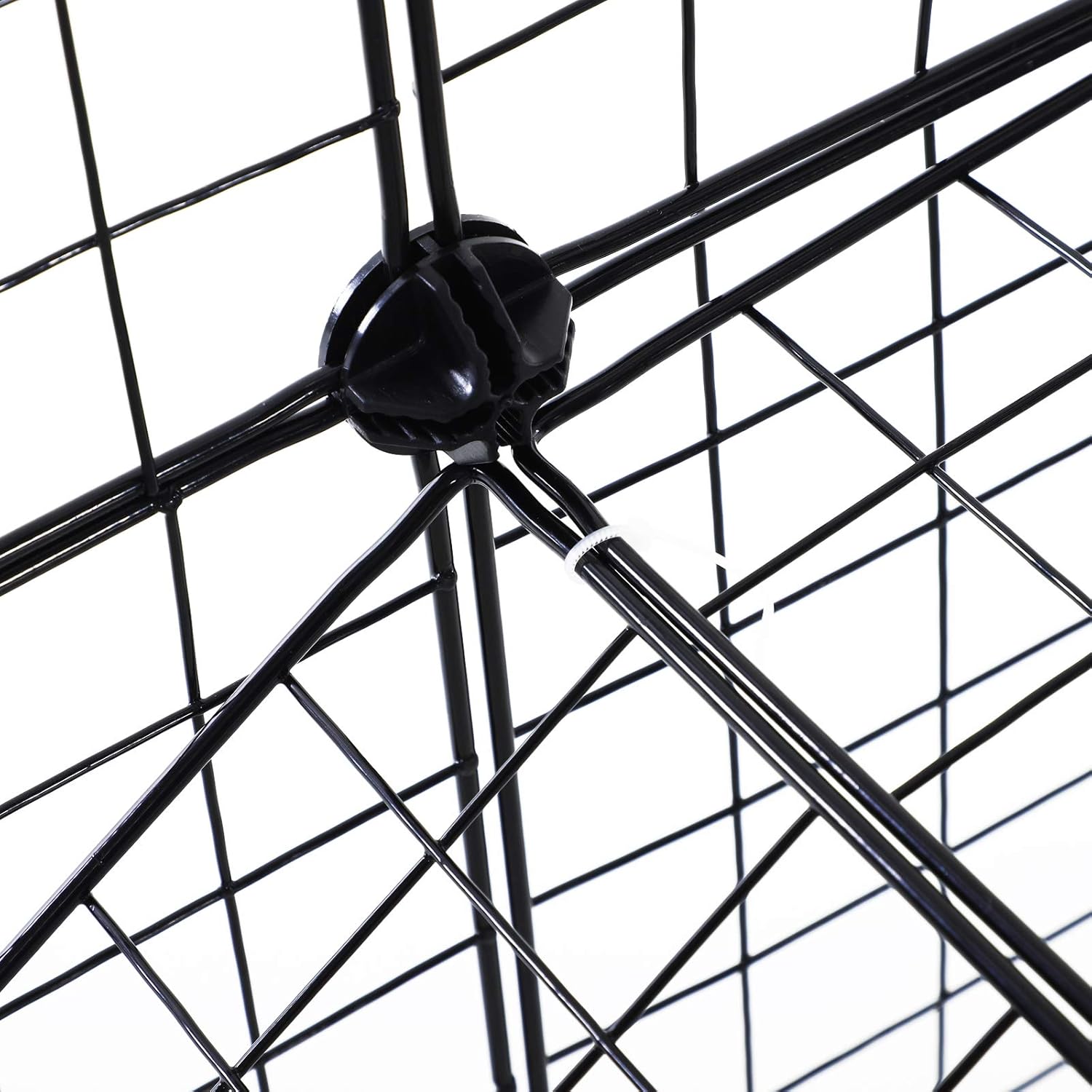 Close-up image of a black wire panel corner inserted into a black plastic connector, with a white cable tie securing the connection.