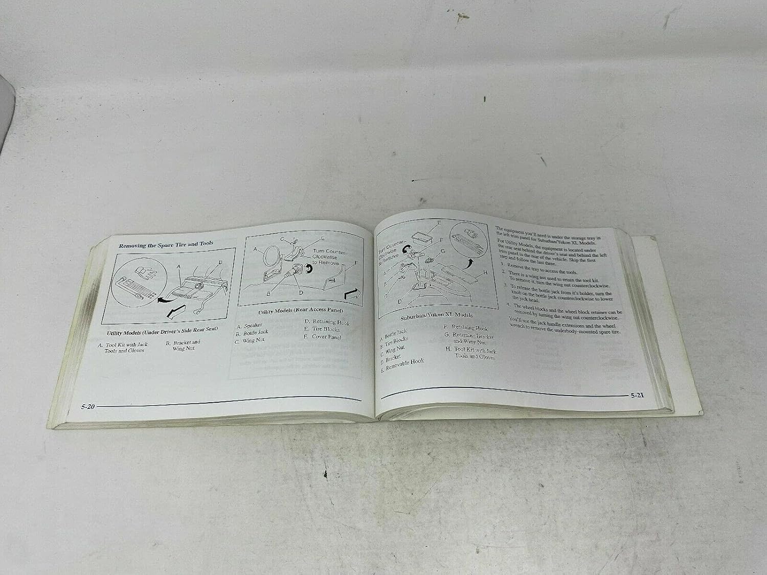 Page from the manual showing spare tire removal instructions