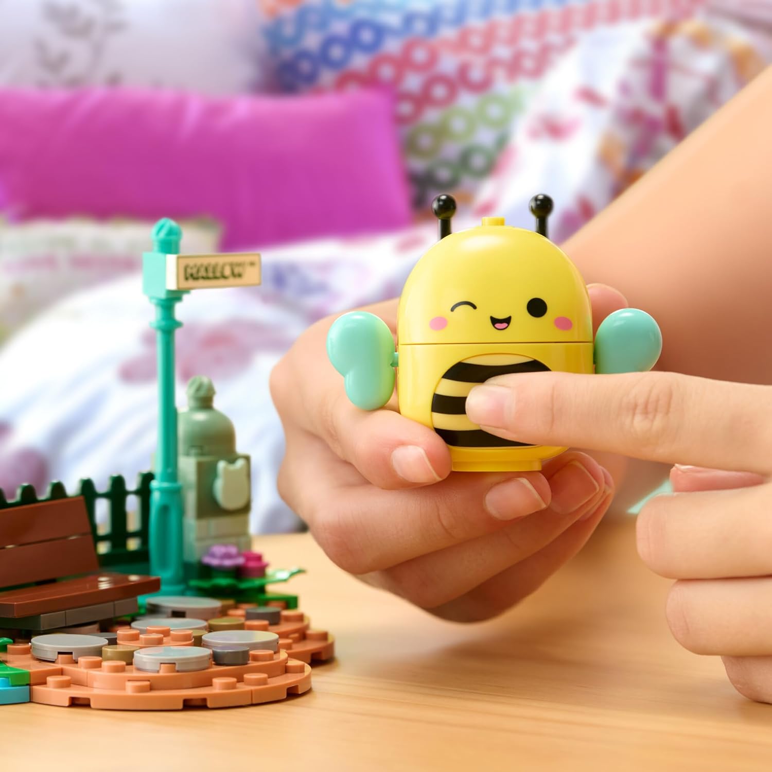 Child playing with BLDR Squishmallows Sunny's Park Life Building Set