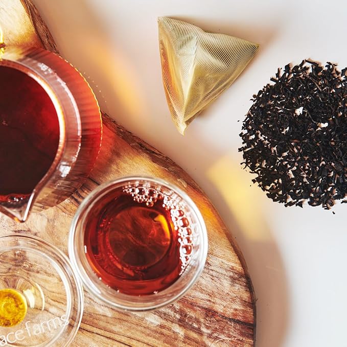 Grace Farms Organic Earl Grey Black Tea is a high-quality black tea blend infused with bergamot oil for a distinctive and refreshing flavor profile. This Fairtrade and Kosher certified tea is sourced from organic and sustainable farms, ensuring both environmental sustainability and ethical practices in production.