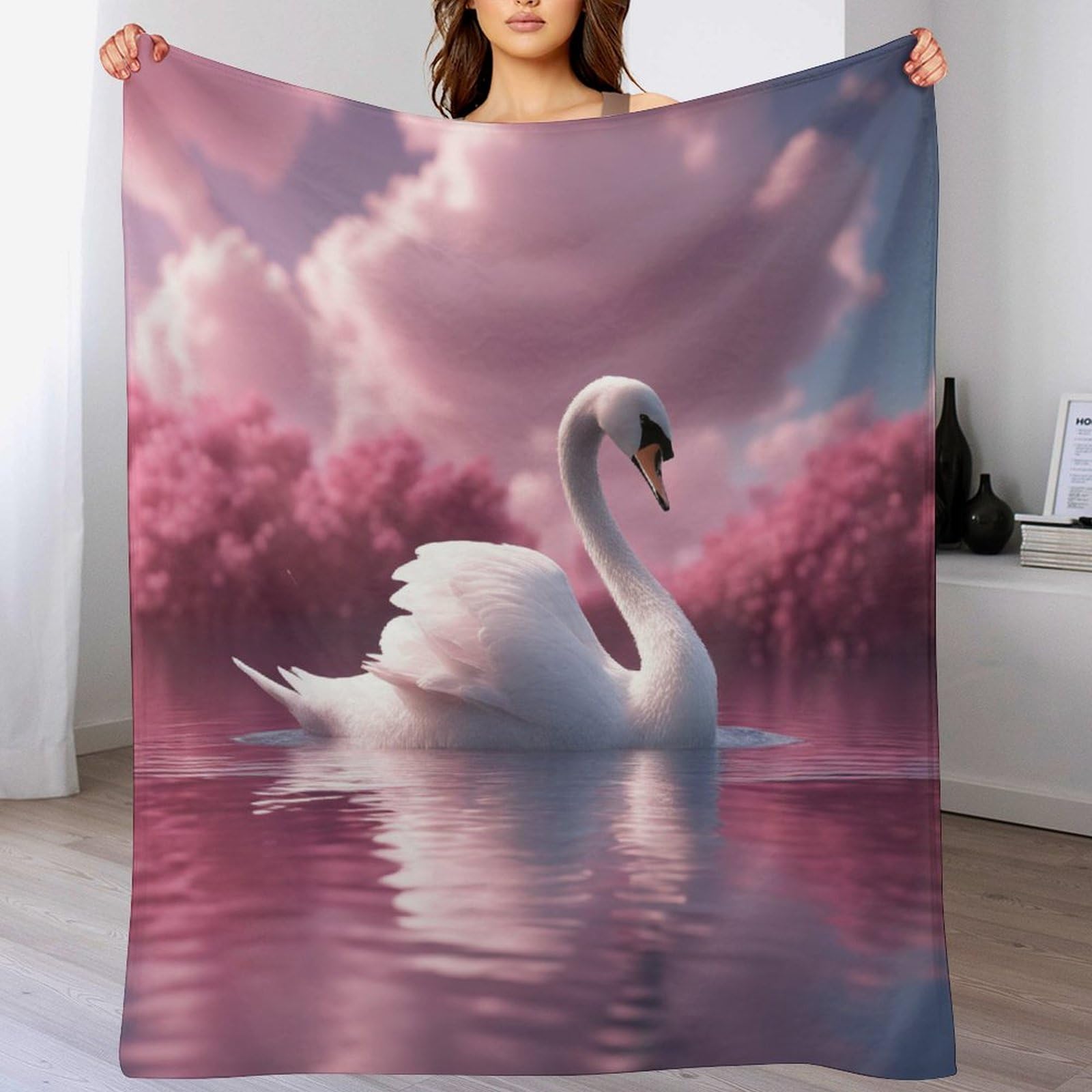 Couverture cygne polaire pour des soirées cocooning confortables sur le canapé