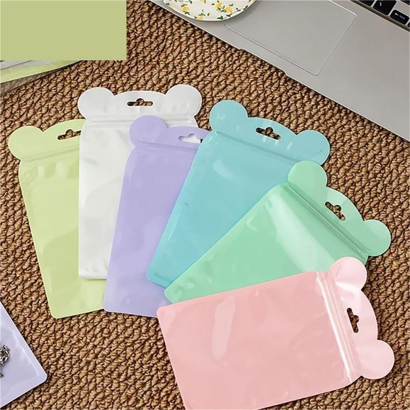 100 bolsas de plástico multicolores autoselladas.