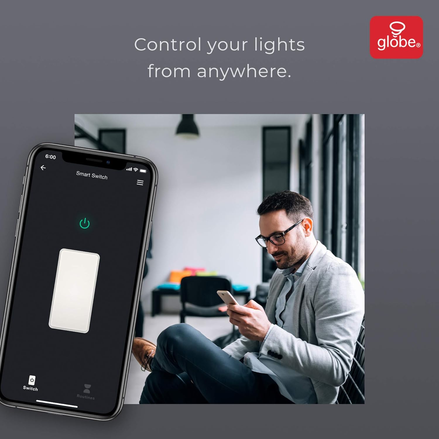 Person using a smartphone to control a smart switch via an app, with a man sitting in an office in the background