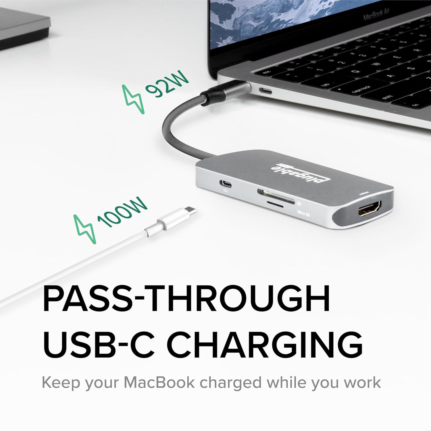 The Plugable USB-C Hub with three USB flash drives plugged into its USB 3.0 ports, illustrating data transfer capabilities.