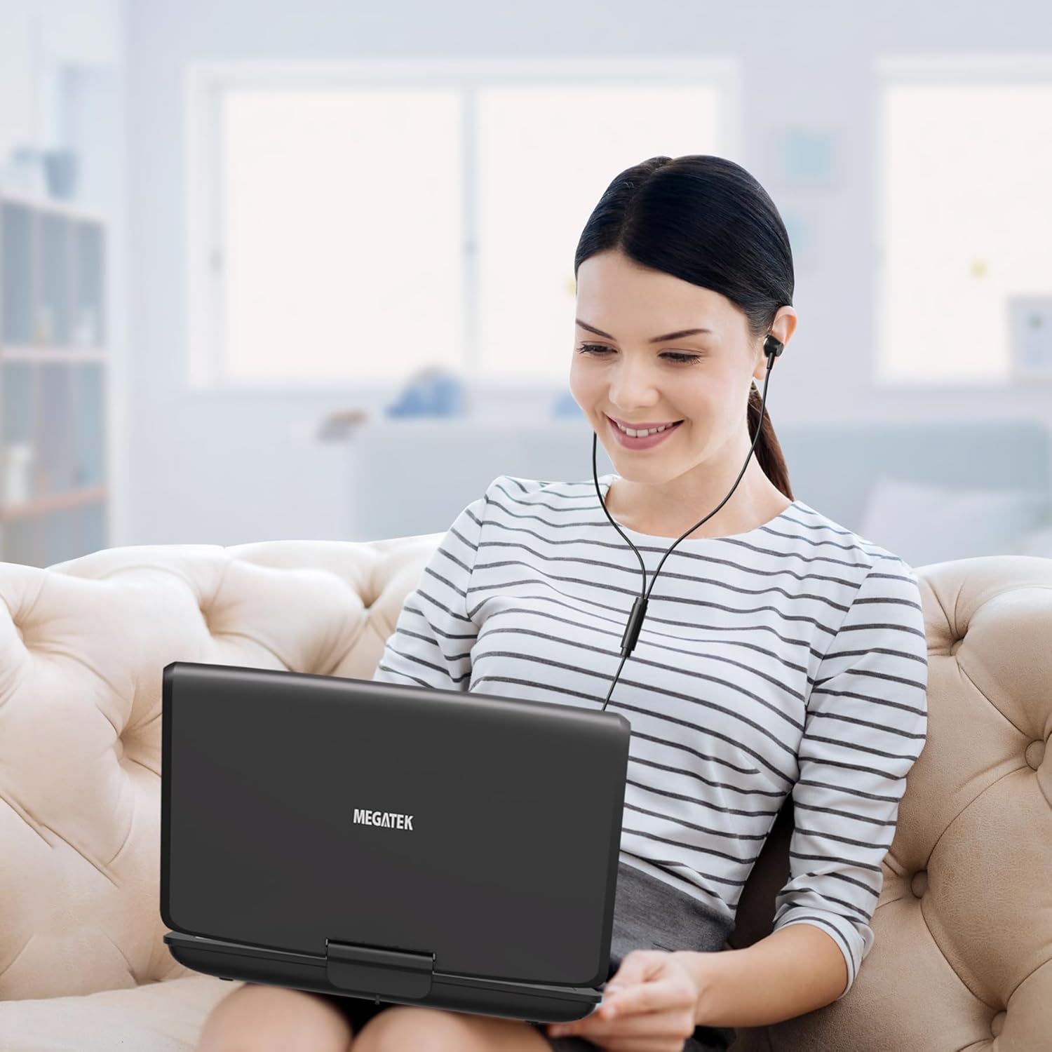 Woman using MEGATEK PD-1256 Portable DVD Player with MEGATEK Earbud Headphones.