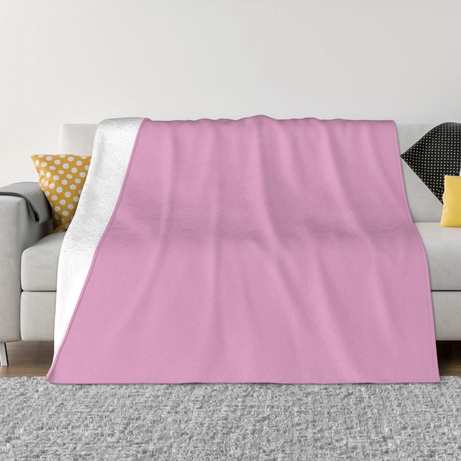 Couverture de canapé chaude rose pour des soirées cocooning au salon