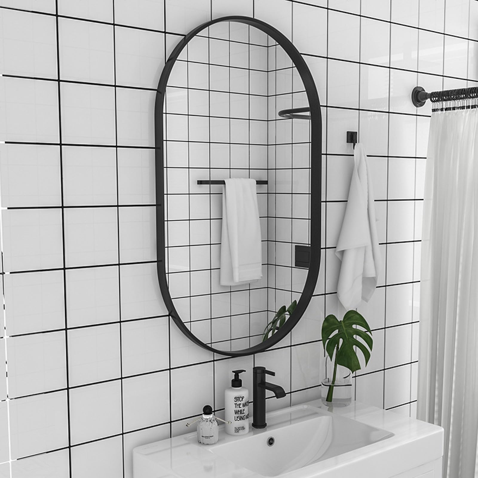 Miroir mural ovale avec cadre en métal noir pour salon et entrée contemporaine