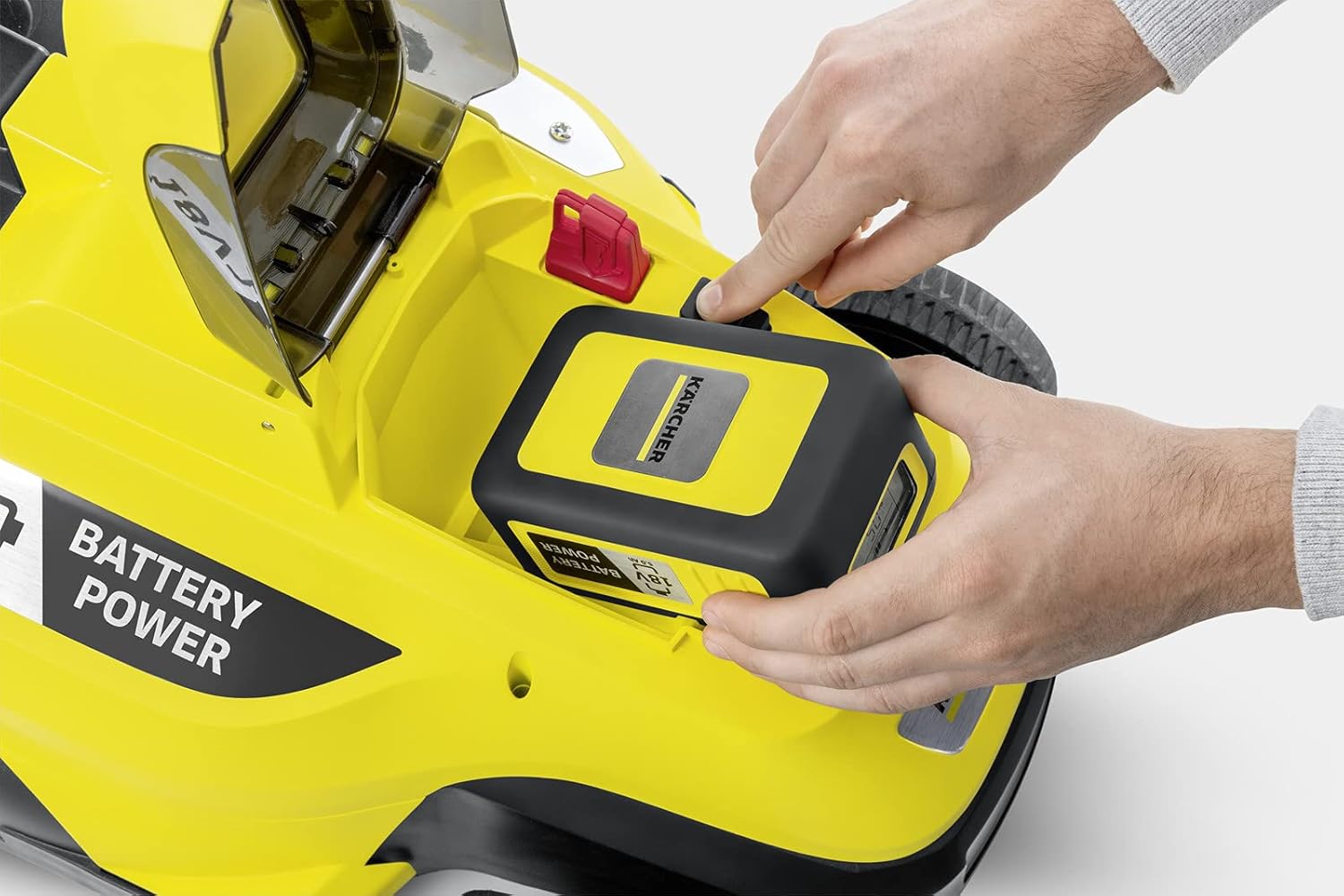 Person operating Kärcher LMO 18-36 Lawnmower on a lawn